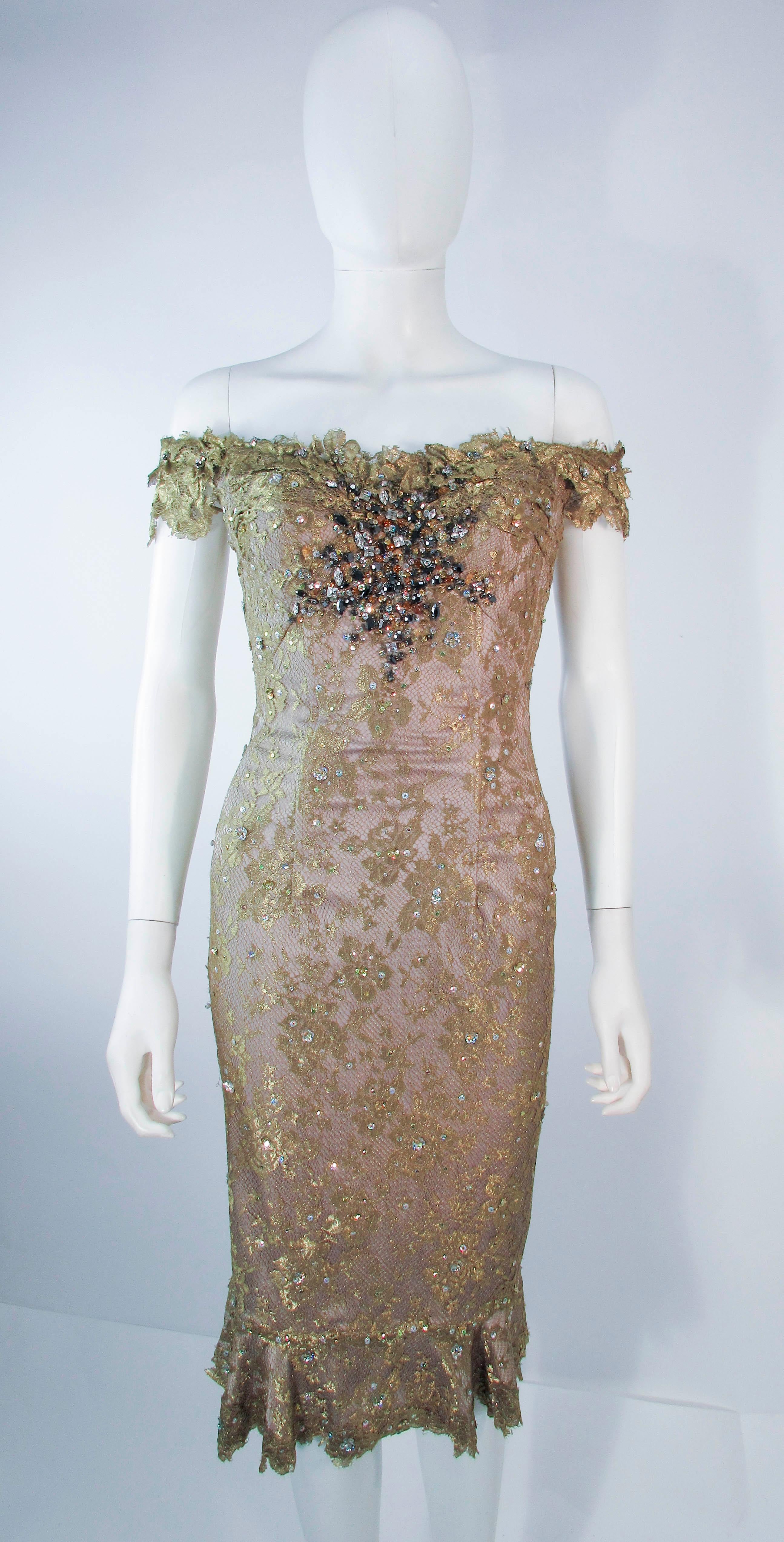 This is a Madalay cocktail dress, it is composed of a gold metallic with a beaded and sequin applique. Features an off the shoulder style with corset boning and a center back zipper closure. In excellent pre-owned condition, shows some signs of wear