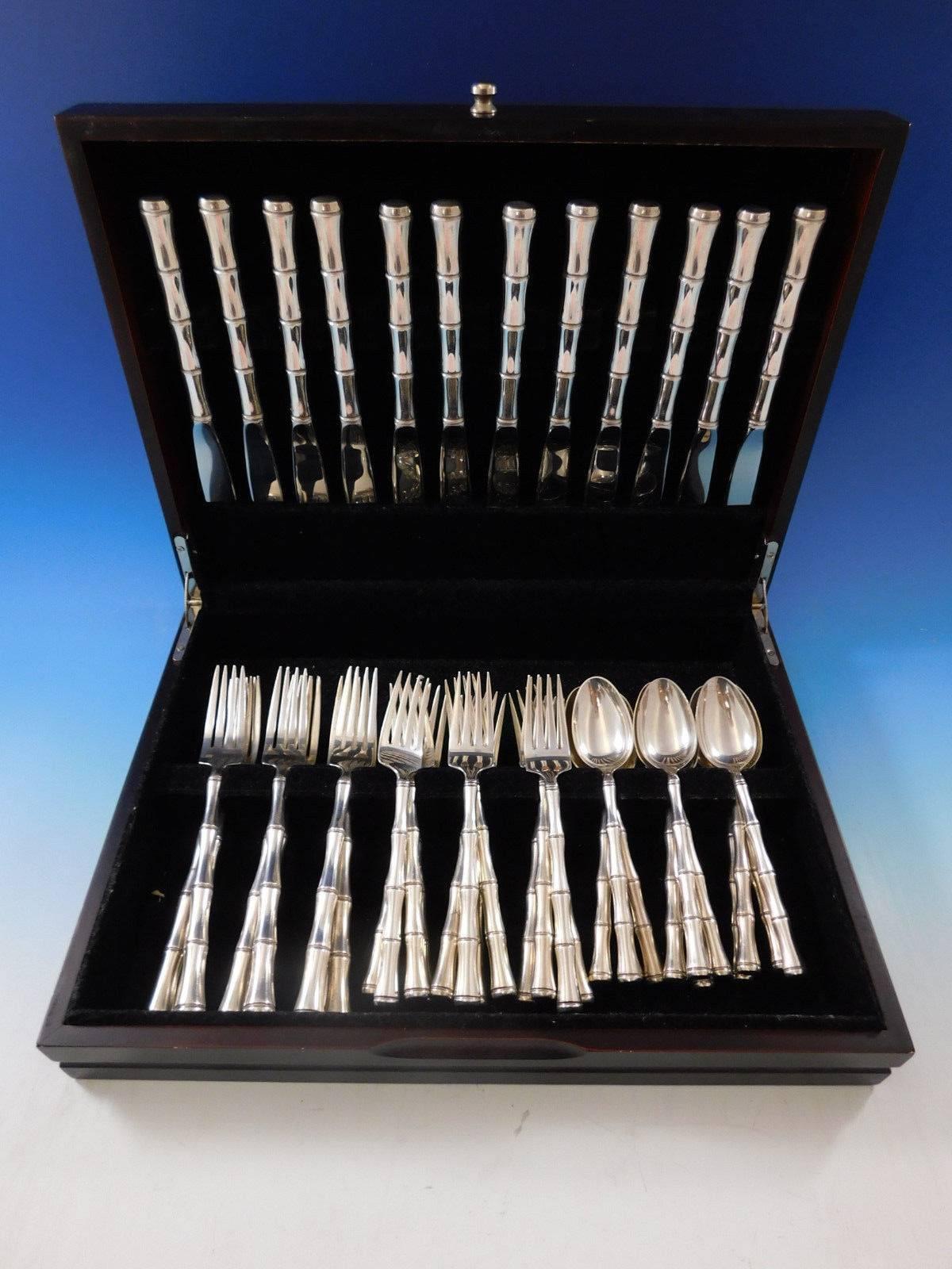 Mandarin by Towle Sterling silver flatware set of 48 pieces. This chinoiserie style flatware service has hollow 3-D bamboo pattern handles. This set includes:

12 knives, 9 1/8