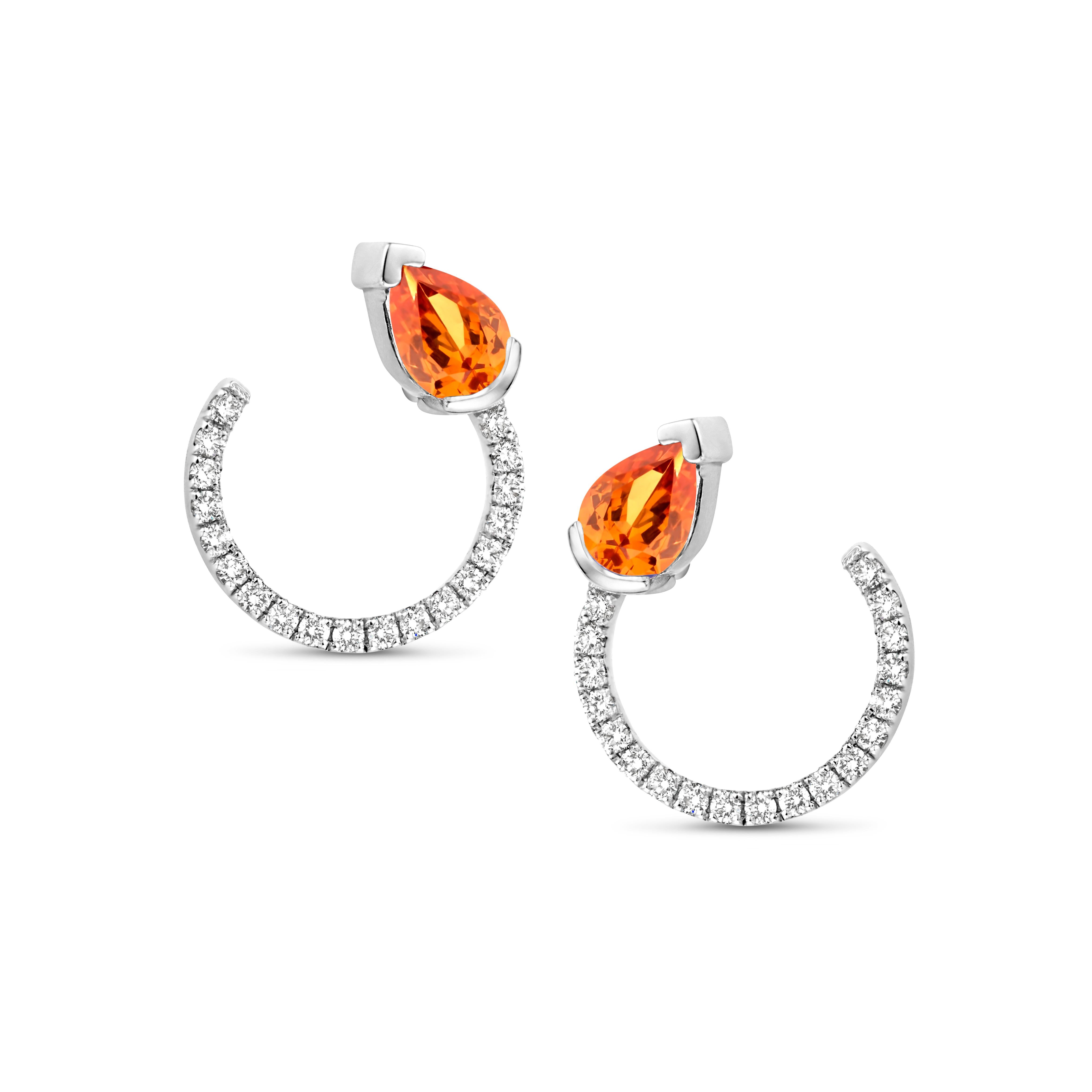 18K rose gold curved earrings with a pear shaped mandarin garnet 0,78ct and diamonds 0,30ct VS-FG brilliant cut. Also, available in white gold and yellow gold.

Celine Roelens, a goldsmith and gemologist, is specialized in unique, fine jewelry,