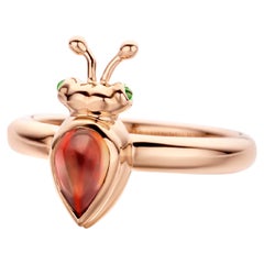 Bague moderne en or rose 18 carats et grenat mandarin