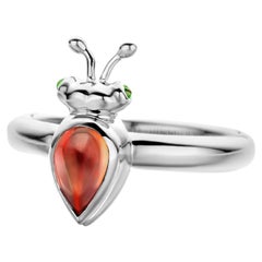 Bague moderne en or blanc 18 carats et grenat mandarin