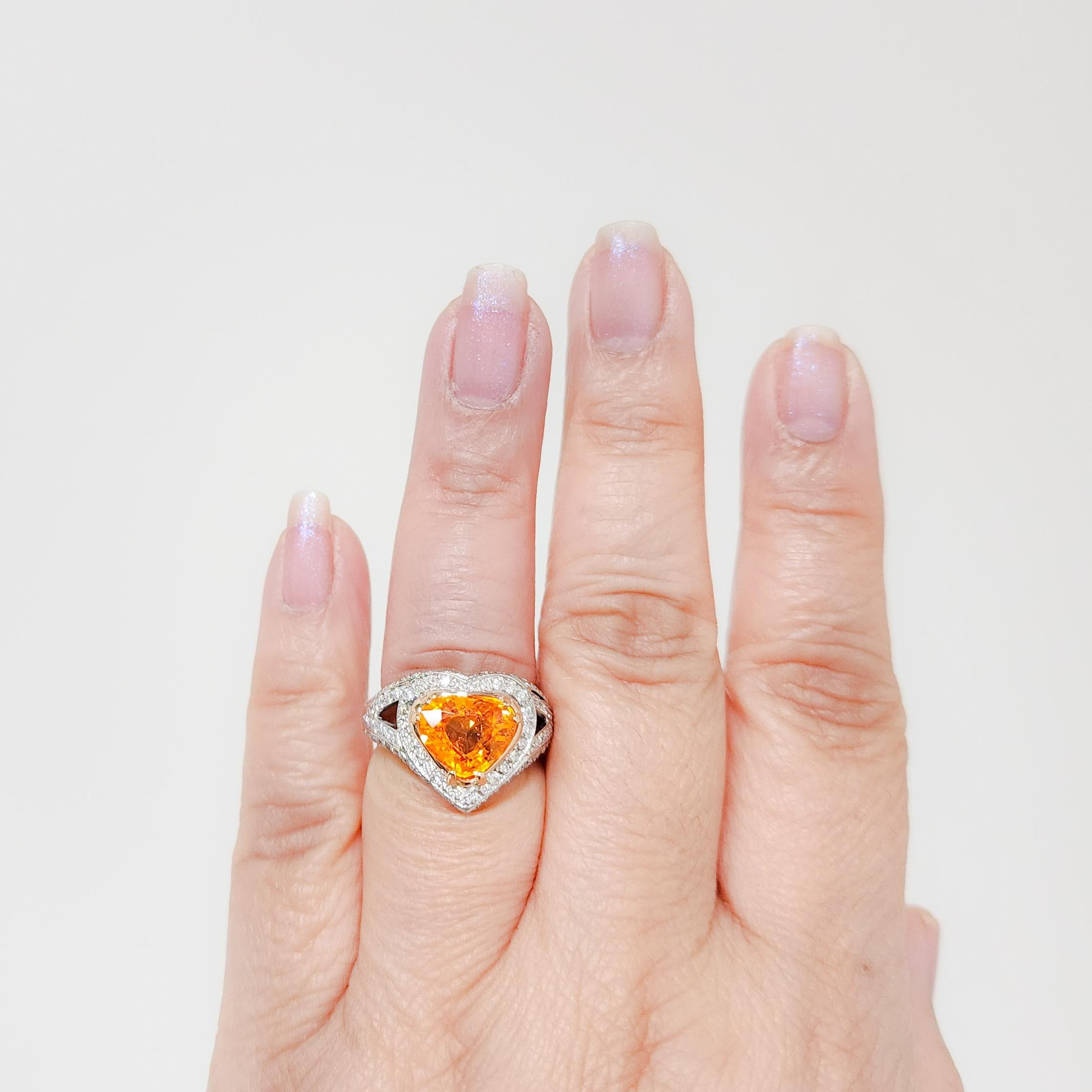 Beautiful 3.95 ct. Mandarin garnet pear shape with 2.00 ct. good quality white diamond rounds.  Handmade in platinum and 18k yellow gold.  Ring size 6.75.
