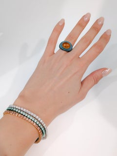 Cabochon-Ring mit Mandaringranat aus grünem Titan und 18k 750 Roségold von MXHM