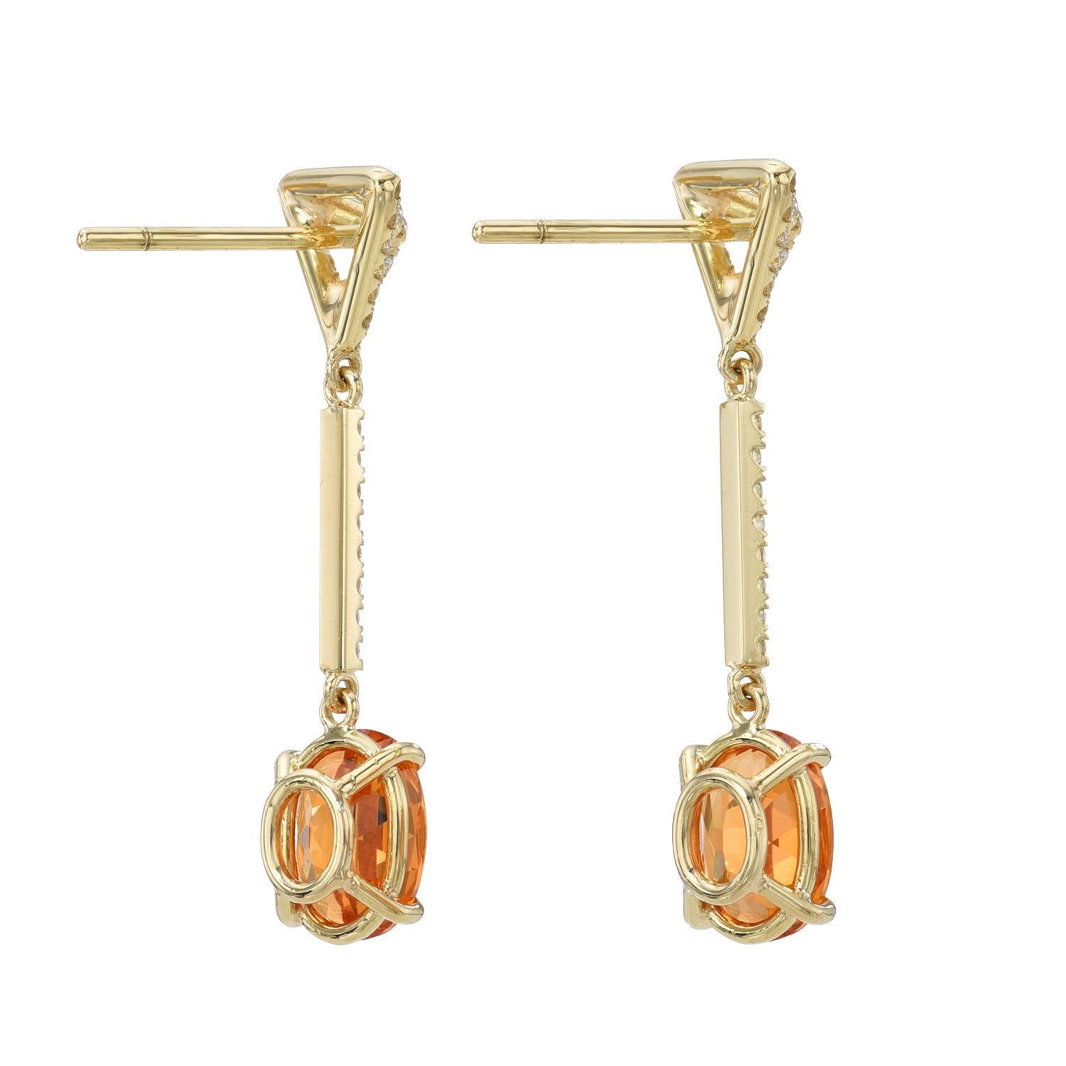 Striking 3.70 carat oval Mandarin Garnet, 18K yellow gold earrings, decorated with a total of 0.35 carat round brilliant collection diamonds, suspending from our signature three dimensional triangle diamond studs.
Crafted by extremely skilled hands