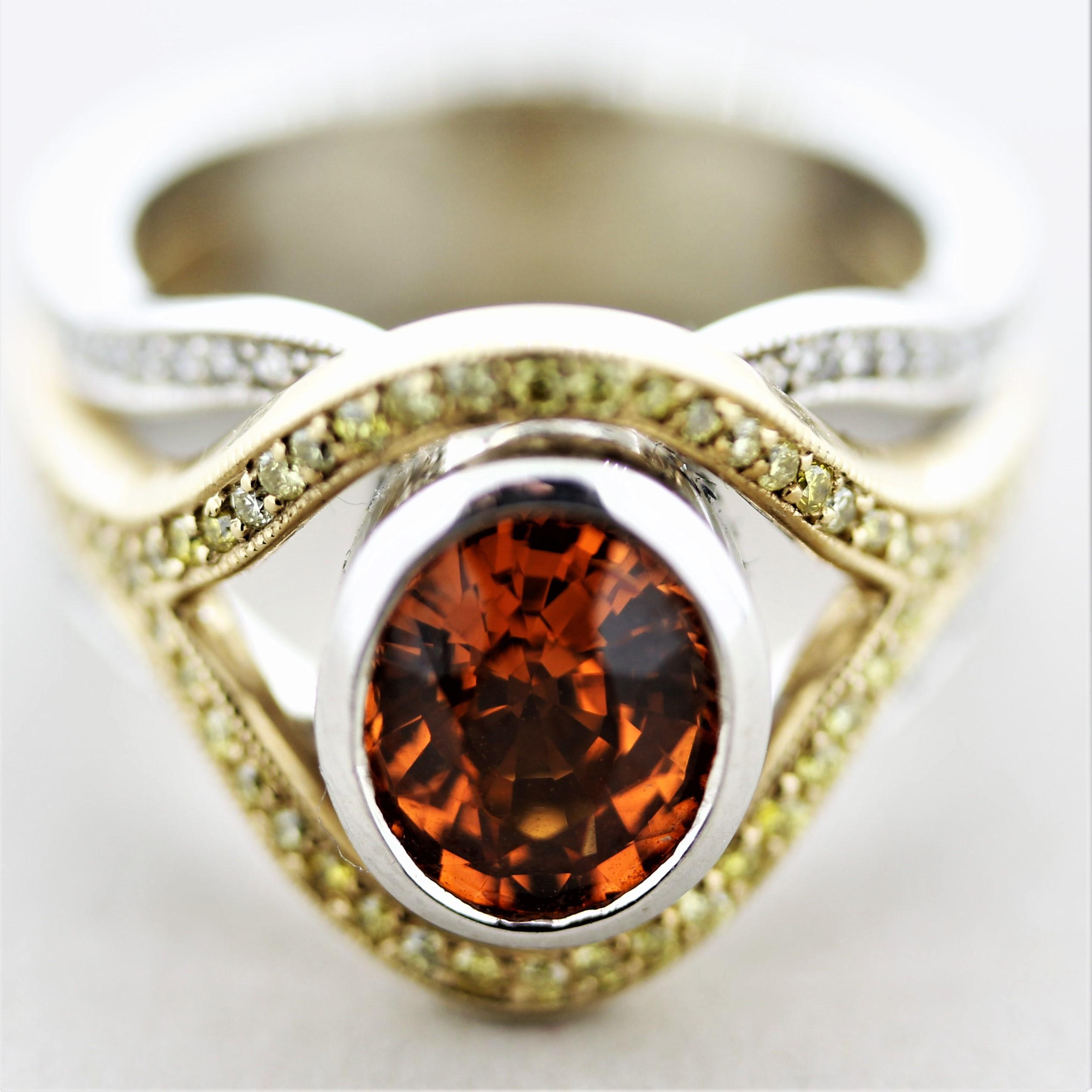 Une bague unique et élégante présentant un grenat spessartine fin, appelé mandarine dans le commerce lorsque la couleur est fine, pesant 2.68 carats. Elle a une couleur orange vif et est exempte de toute inclusion visible, ce qui permet de mettre en