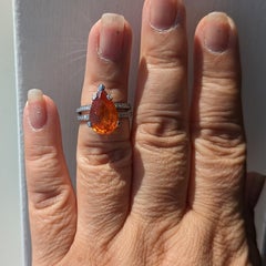 Mandarin Garnet Pear and White Diamond Round Diamond Ring in Platinum