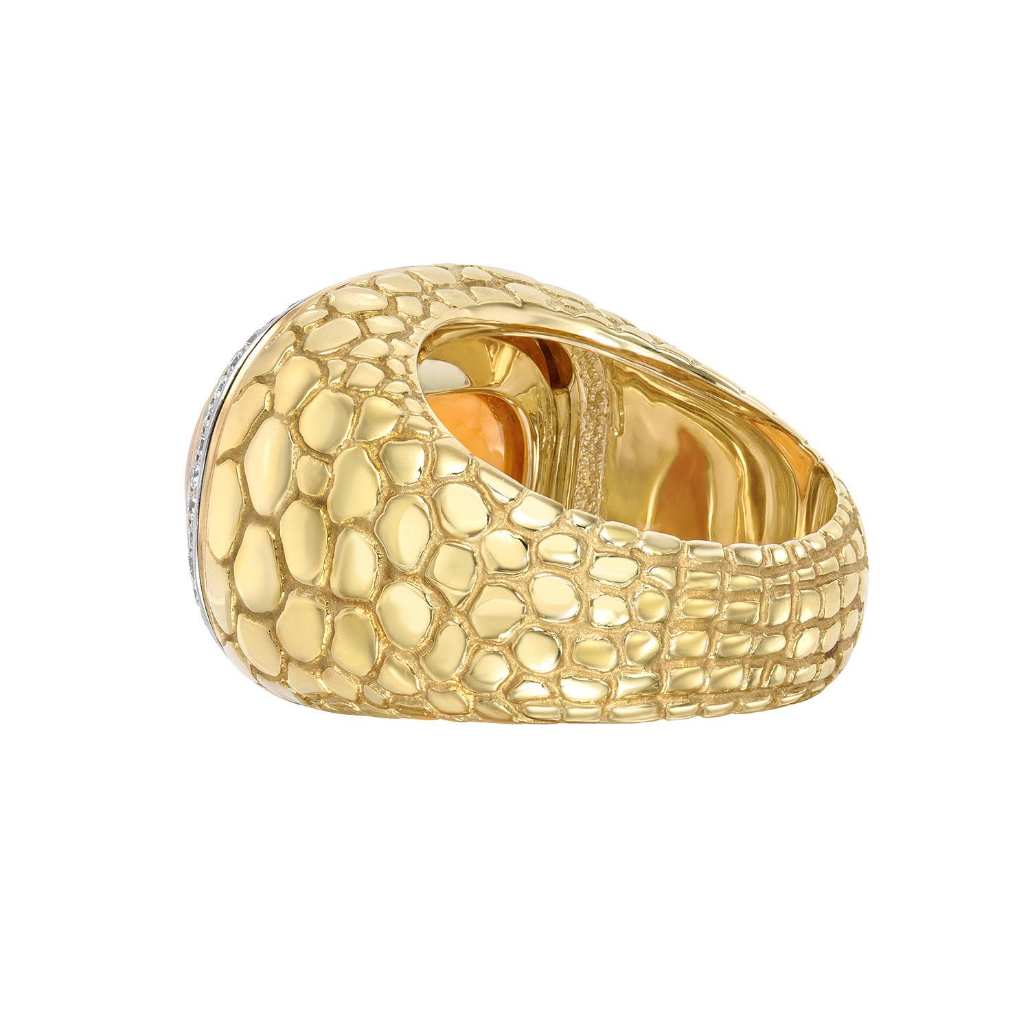18K yellow gold and platinum Crocodile pattern ring featuring an incredible 29.93 carat Mandarin Garnet Sugarloaf Cabochon surrounded by a total of 0.40 carat round brilliant diamonds.
Ring size 6. Resizing is complimentary upon request.
Returns are