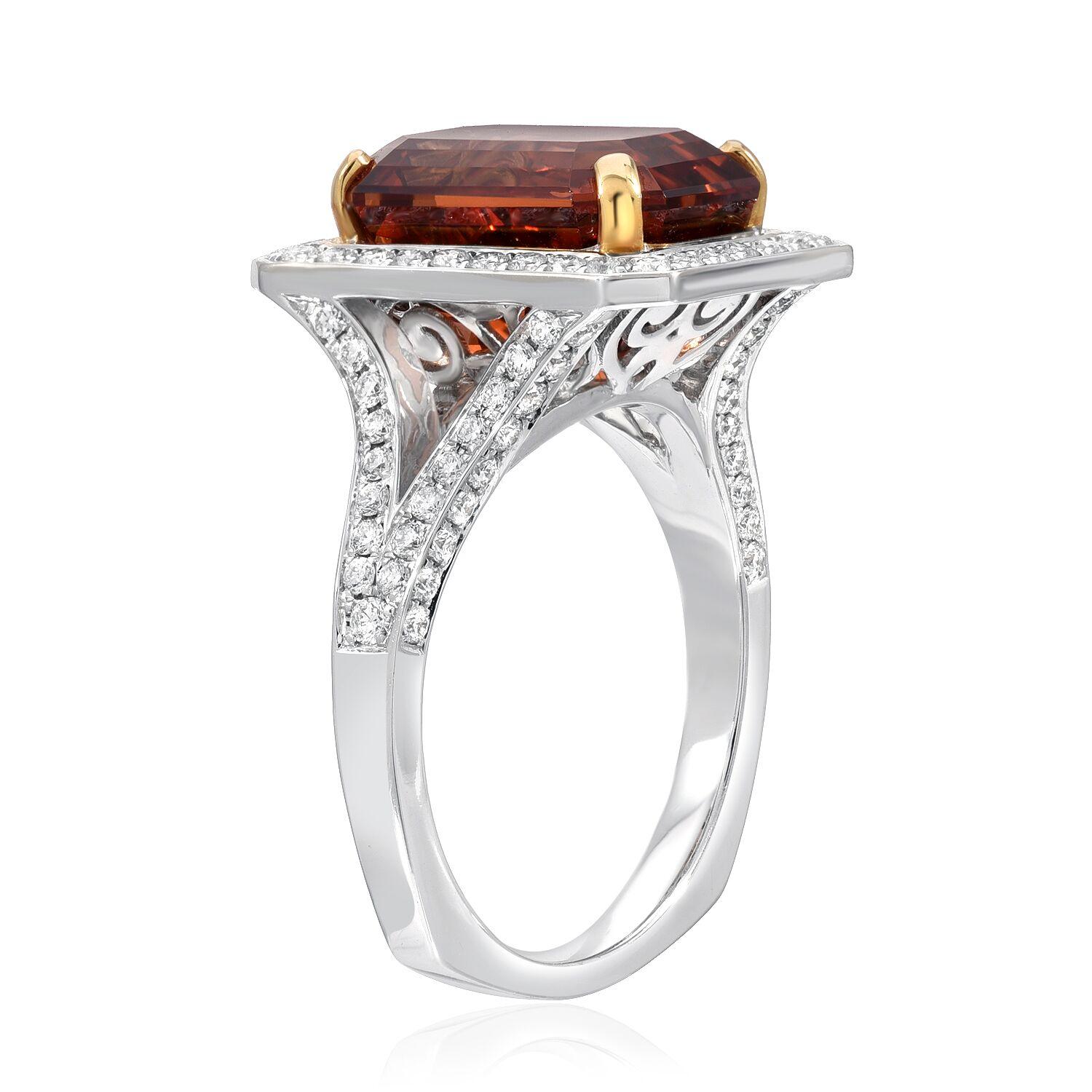 Mandarin Garnet ring, showcasing an 8.73 carat emerald cut, secured by 18K yellow gold prongs, and hand set in a diamond setting weighing a total of 1.02 carats, in 18K white gold.
Ring size 6.5. Re-sizing is complimentary upon request.
Returns are