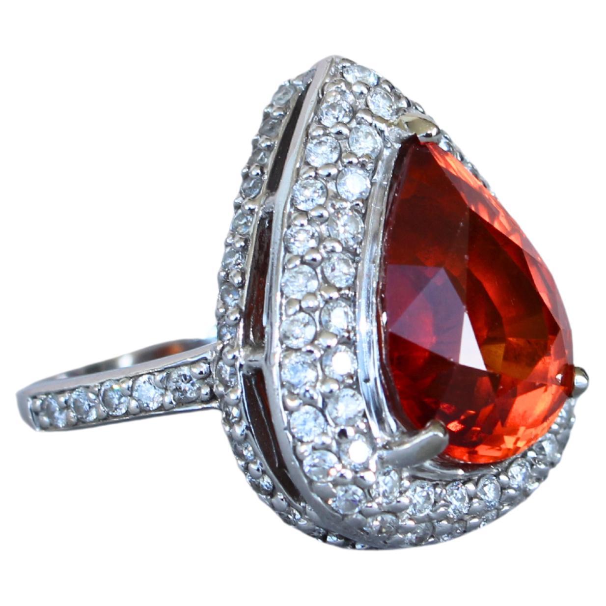 Mandarin Garnet Spessartine Pear Drop Shape Diamond Halo Pave White Gold Ring
8 Carats of Stunning Mandarin Garnet Spessartine in Pear-Shape Brilliant Cut Form
10.1 grams total weight
14K White Gold
14 x 10 mm length width ratio of center stone
2.00