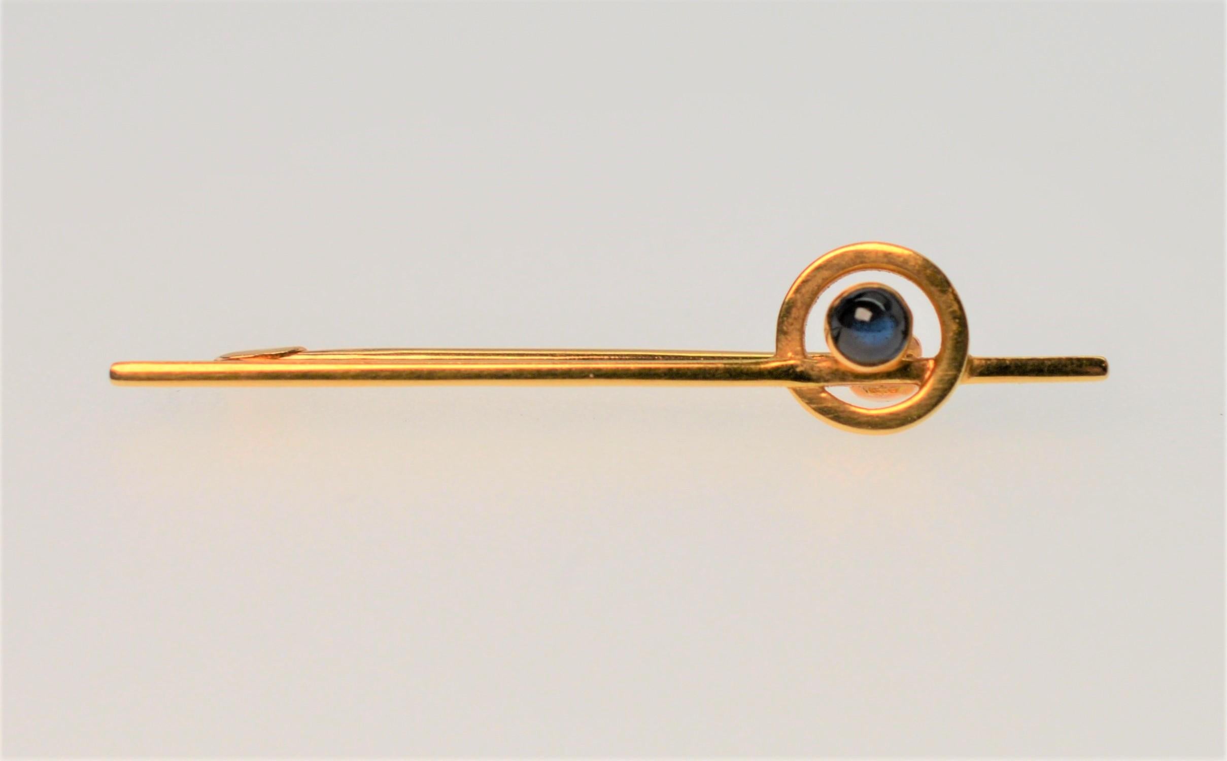 Mandelli Cahors 14K Yellow Gold Stick Pin with Bright Blue Sapphire Cabachon Gemstone. In original 19th Century Box.
Pin measures 39mm long and the Sapphire is .05 ct. Total Weight 1.6 pennyweight.   