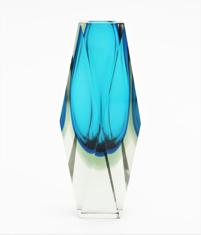 Beautiful faceted Murano glass Sommerso vase in blue color attributed to Mandruzzato. Italy, 1960s. 
Blue glass awith a layer in darker blue cased into clear glass. 
Beautiful placed alone or as a part of a collection with other Murano glass
