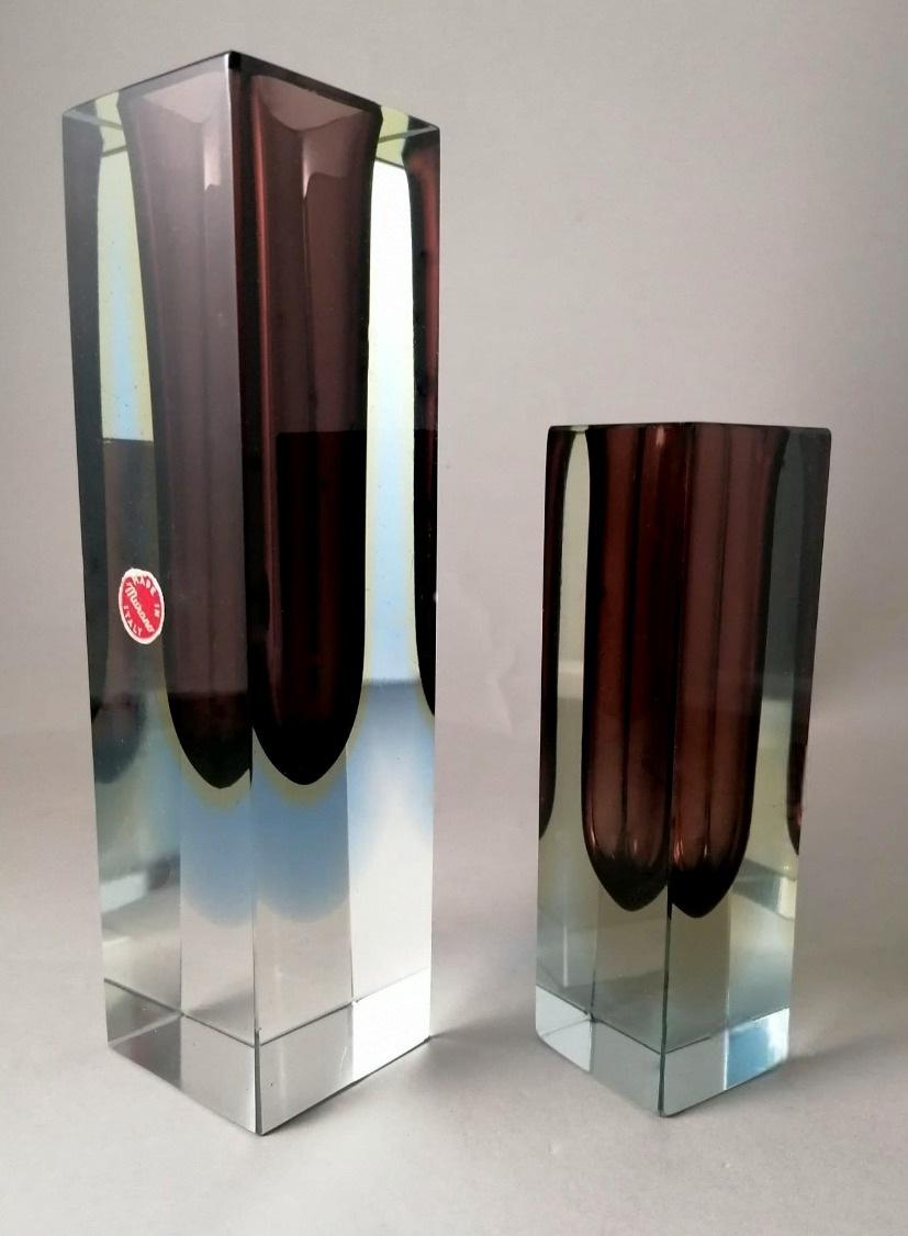 We kindly suggest that you read the whole description, as with it we try to give you detailed technical and historical information to guarantee the authenticity of our objects.
The pair consists of two massive and linear Murano glass vases of three