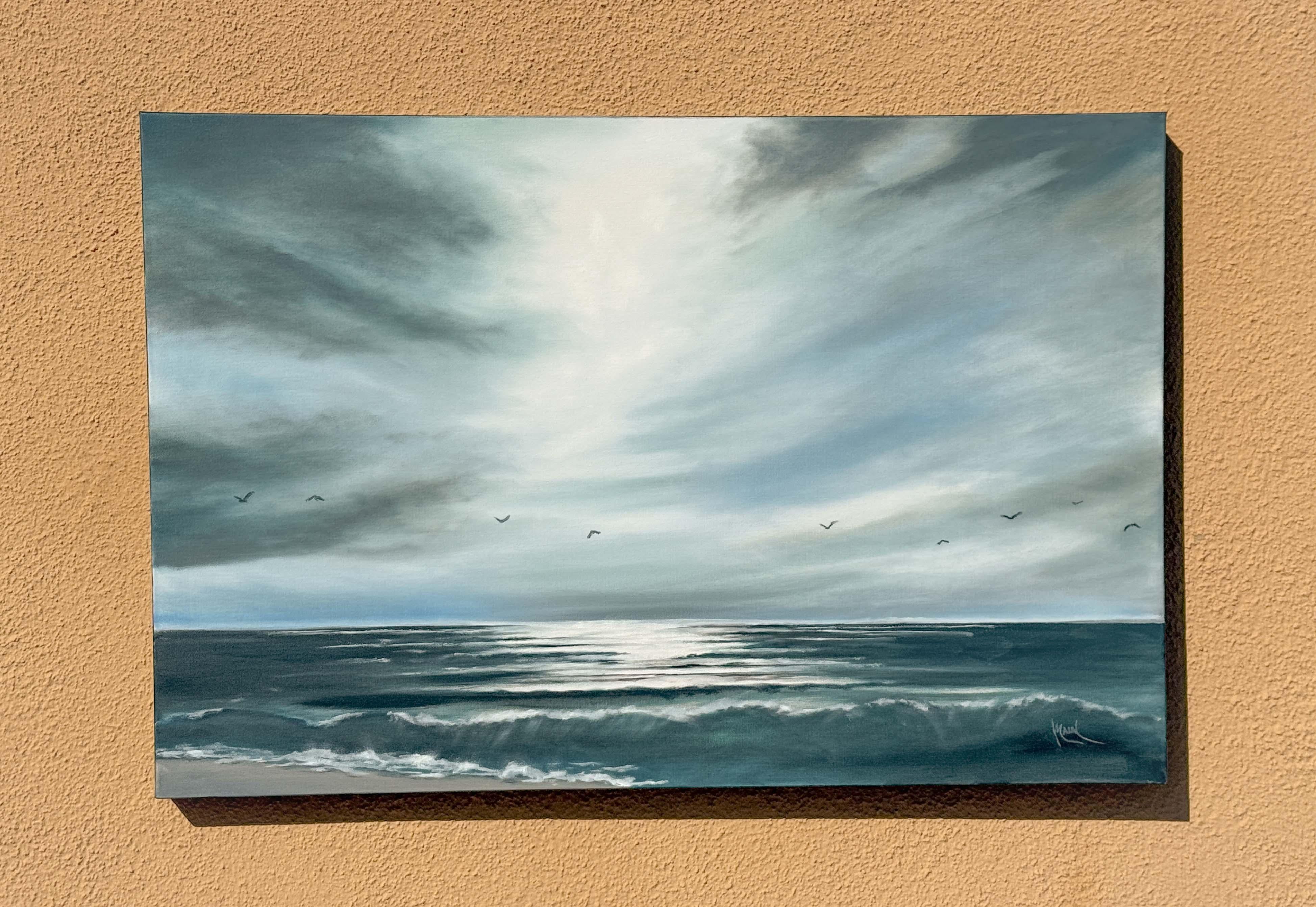 <p>Artist Comments<br>Sweeping, layered clouds fill the sky, creating a dramatic contrast between light and shadow. Gentle waves with soft white foam at their crest roll towards the shore as the backlight brings out the teal hue of the translucent