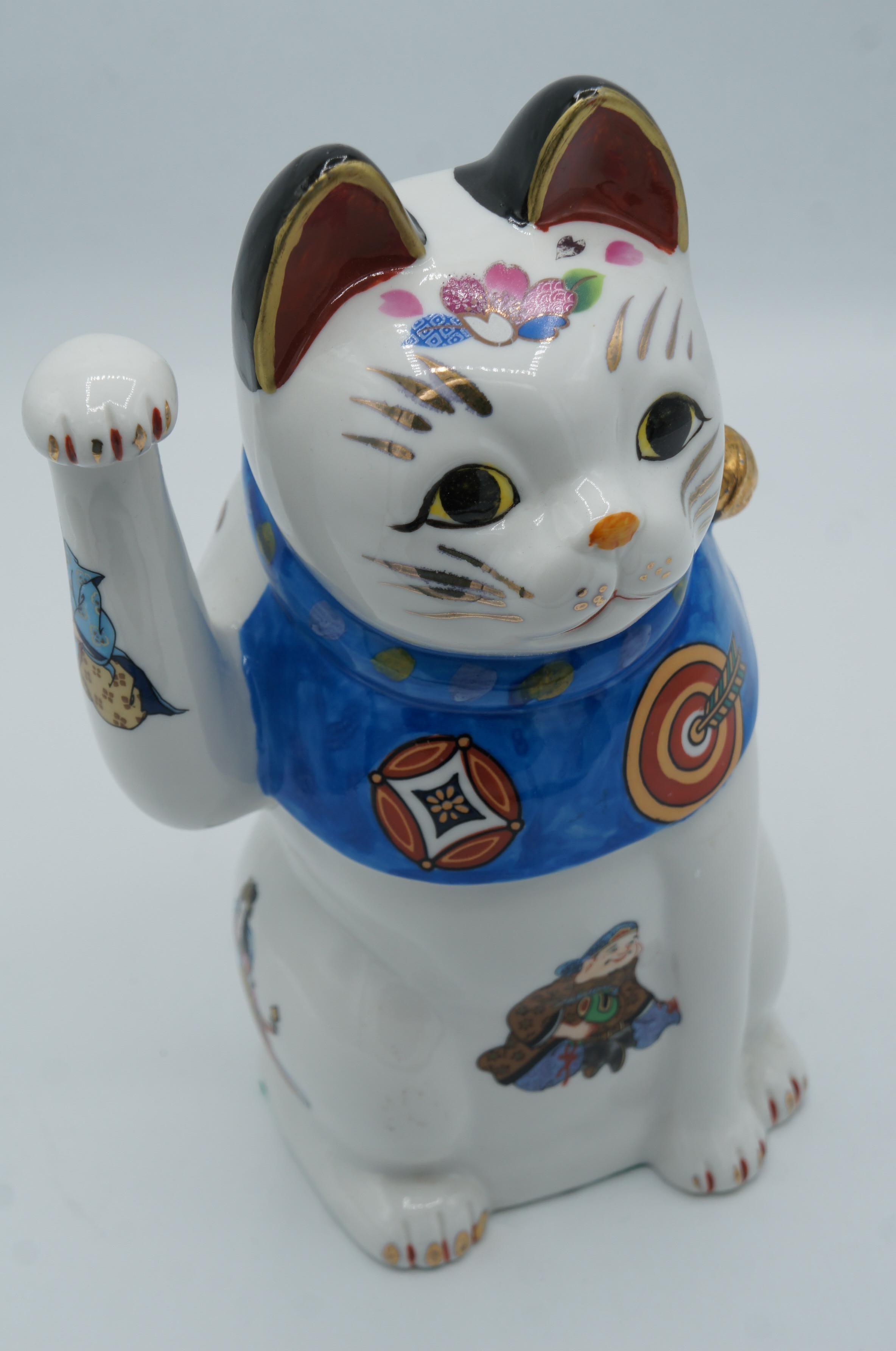 Era: Showa (around 1980)
Material: porcelain
The maneki-neko is a common Japanese figurine which is often believed to bring good luck to the owner. 
*This manekineko is an antique piece made in Japan. It is not a new item and may have small
