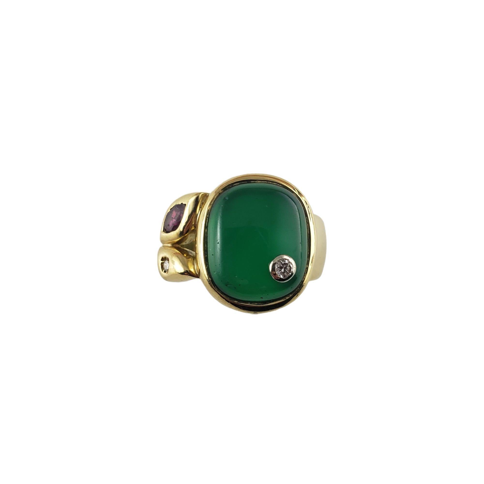 Vintage Manfredi 18 Karat Yellow Gold Green Chrysoprase and Diamond Ring Size 5-

This elegant ring features one green chrysoprase gemstone (13 mm x 11 mm), one marquis cut ruby and one round brilliant cut diamond set in classic 18K yellow gold.