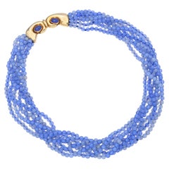 Collana Manfredi a più fili con perline in calcedonio viola e oro giallo 18k
