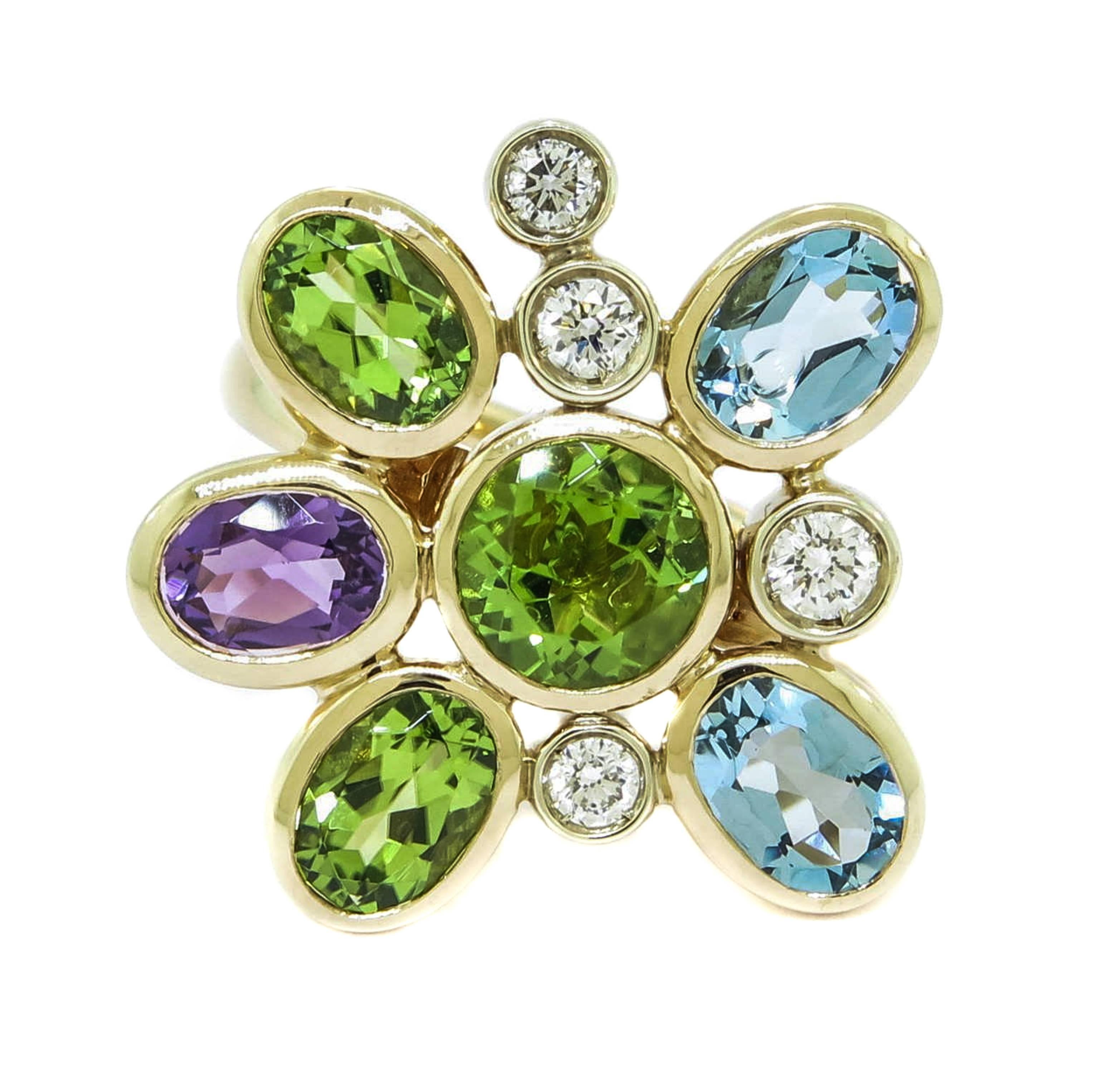 Unique 18 karat yellow gold flower ring featuring diamonds, peridot, aquamarine and amethyst.  Italian craftsmanship shines on this ring by Manfredi of Italy, and is sure to put a smile on your face every time you wear it!