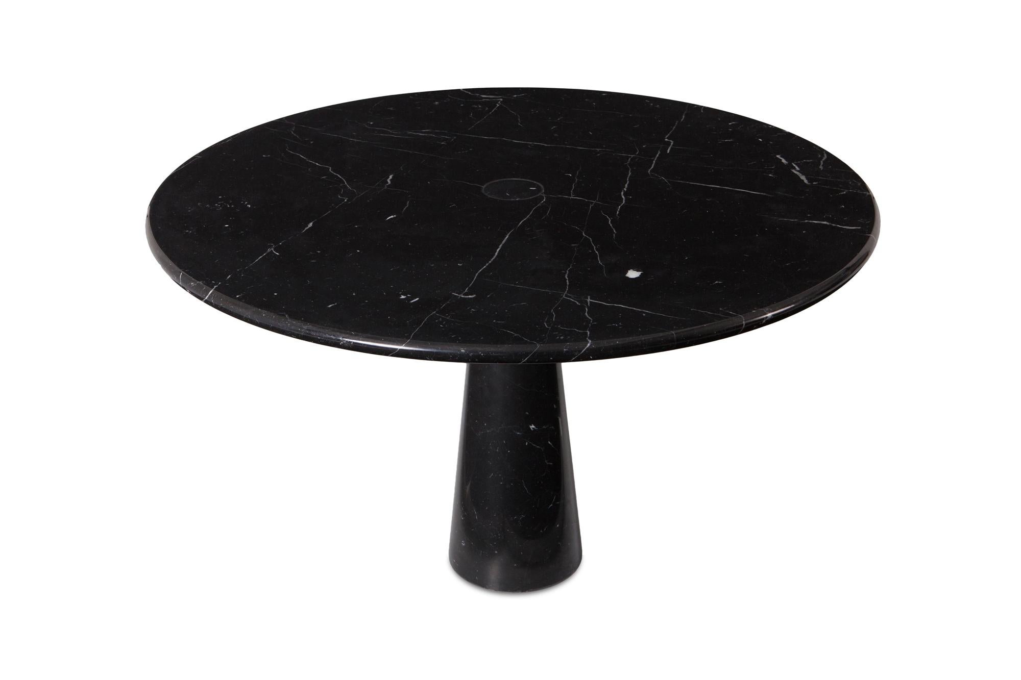 Angelo Mangiarotti black marble dining table - Model: 'Eros'

Designed in 1971 in Italy. Elegant and sculptural piece.
Beautiful white veins running through the black marble.

 