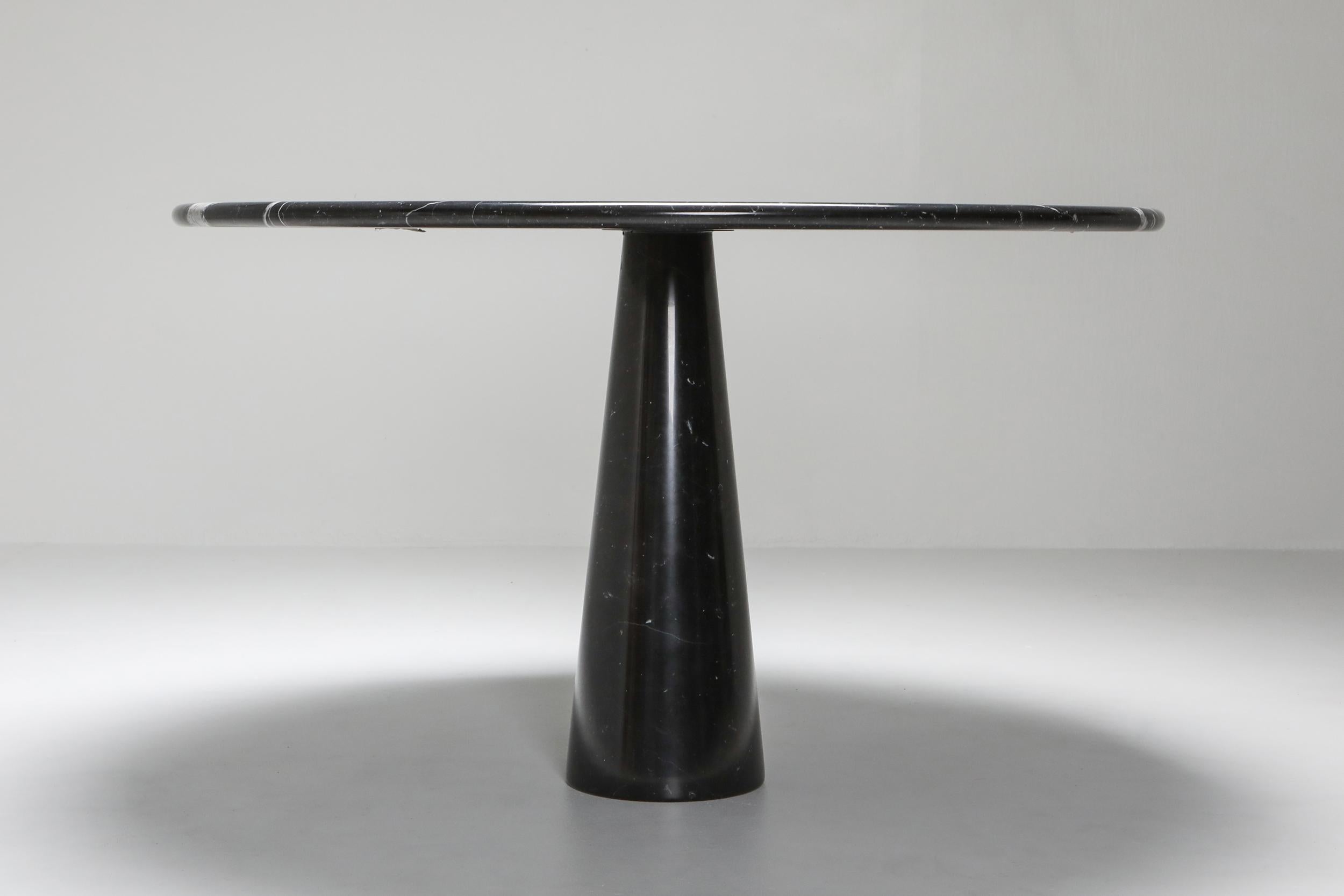 Angelo Mangiarotti, black marble dining table - Model: 'Eros'

Designed in 1971 in Italy. Elegant and sculptural piece.
Beautiful white veins running through the black marble.

                  