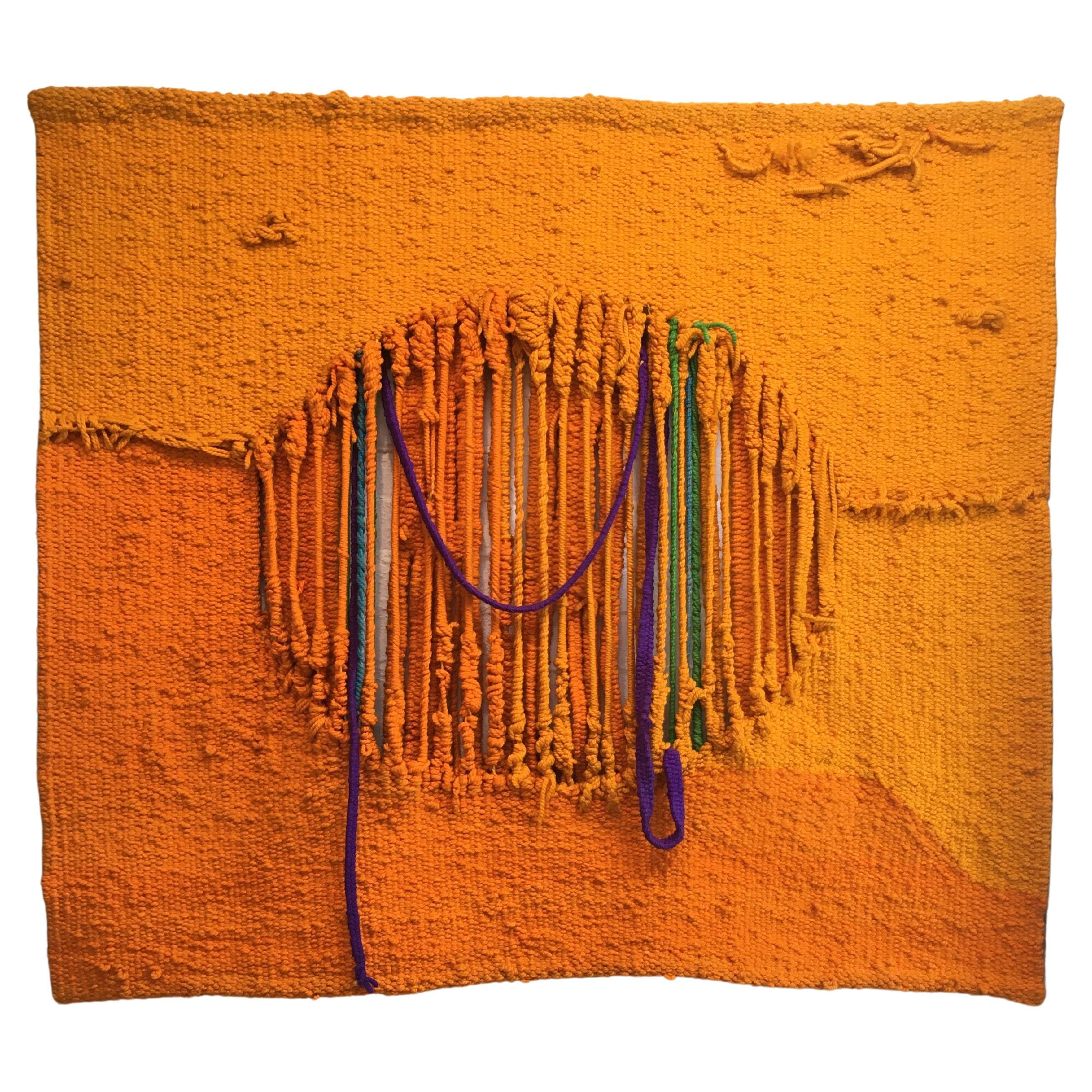 A wildly colourful 1970s hand woven woollen wall hanging by Australian artist Deanna Conti. Titled 'Mango Fool', it's a good example of Conti's work, which focuses on tropical themes and colours. Working from her Queensland studio since the 1970s,