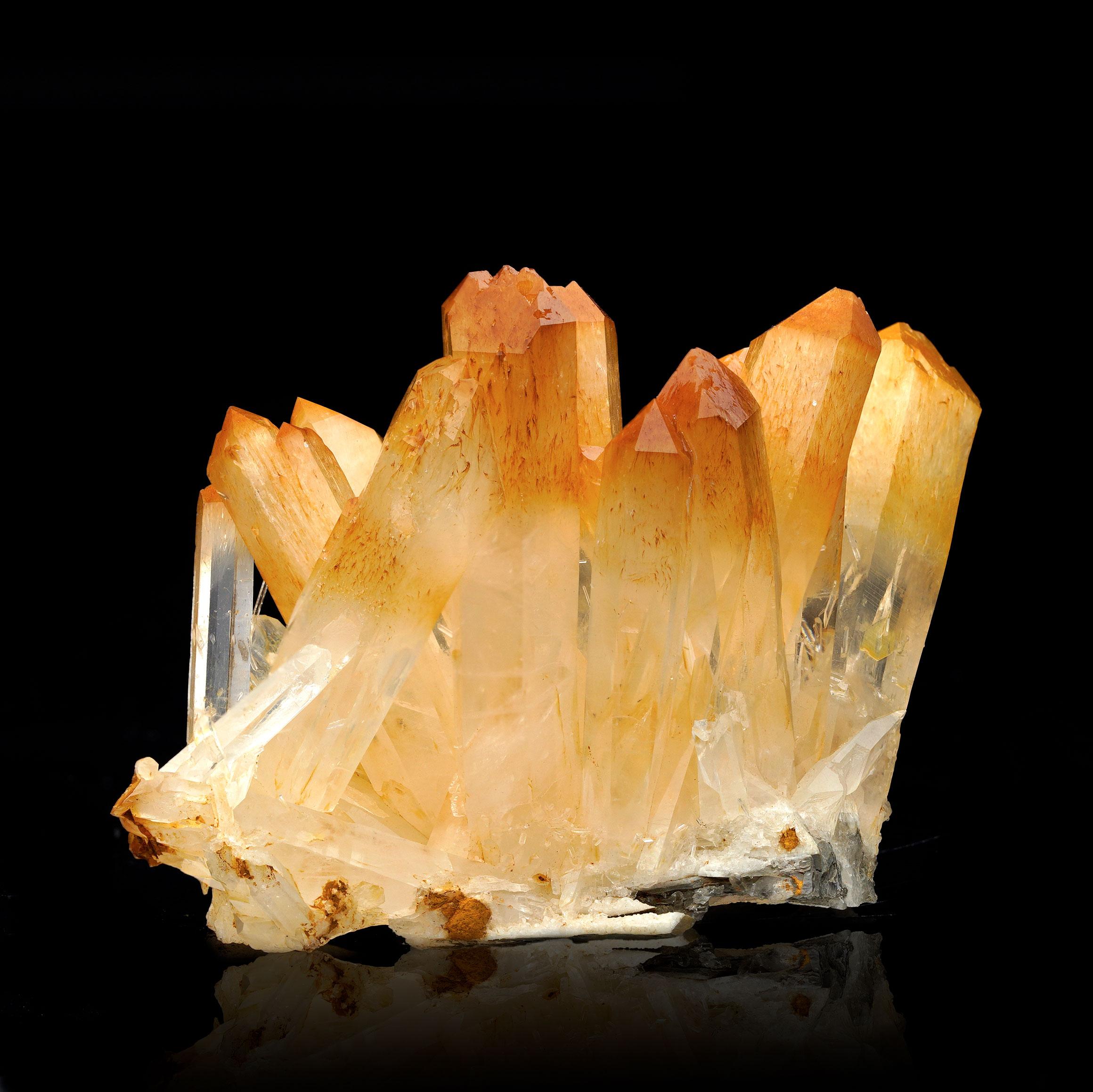 This exquisite Mango Quartz with Halloysite specimen from Colombia is a compact yet striking display of natural beauty. Showcasing the distinct, warm golden tones of Mango Quartz combined with halloysite inclusions, this piece embodies elegance and