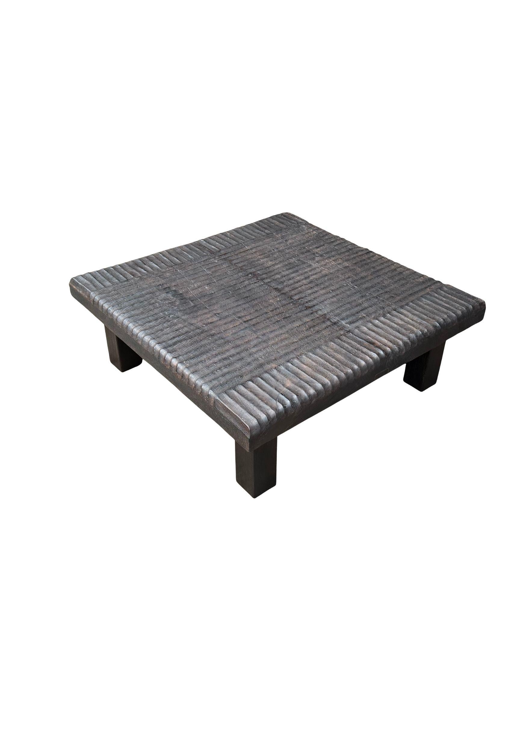 Elevate your living space with this handcrafted mango wood coffee table, finished in a rich, dark brown espresso tone. Each piece is uniquely burned multiple times to achieve its deep, rustic character, giving it a bold and organic aesthetic. The