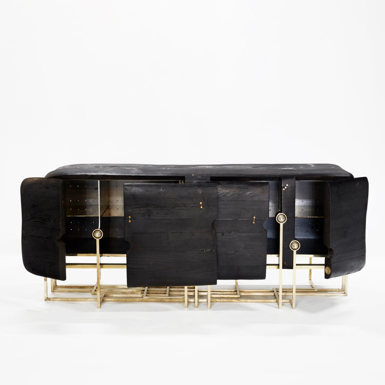 Wooden sideboard Mangrove is a unique piece designed by Erwan Boulloud who is represented by Galerie Negropontes in Paris France. 

Erwan Boulloud is a graduate of the Ecole Boulle. He began by collaborating with a number of designers, while