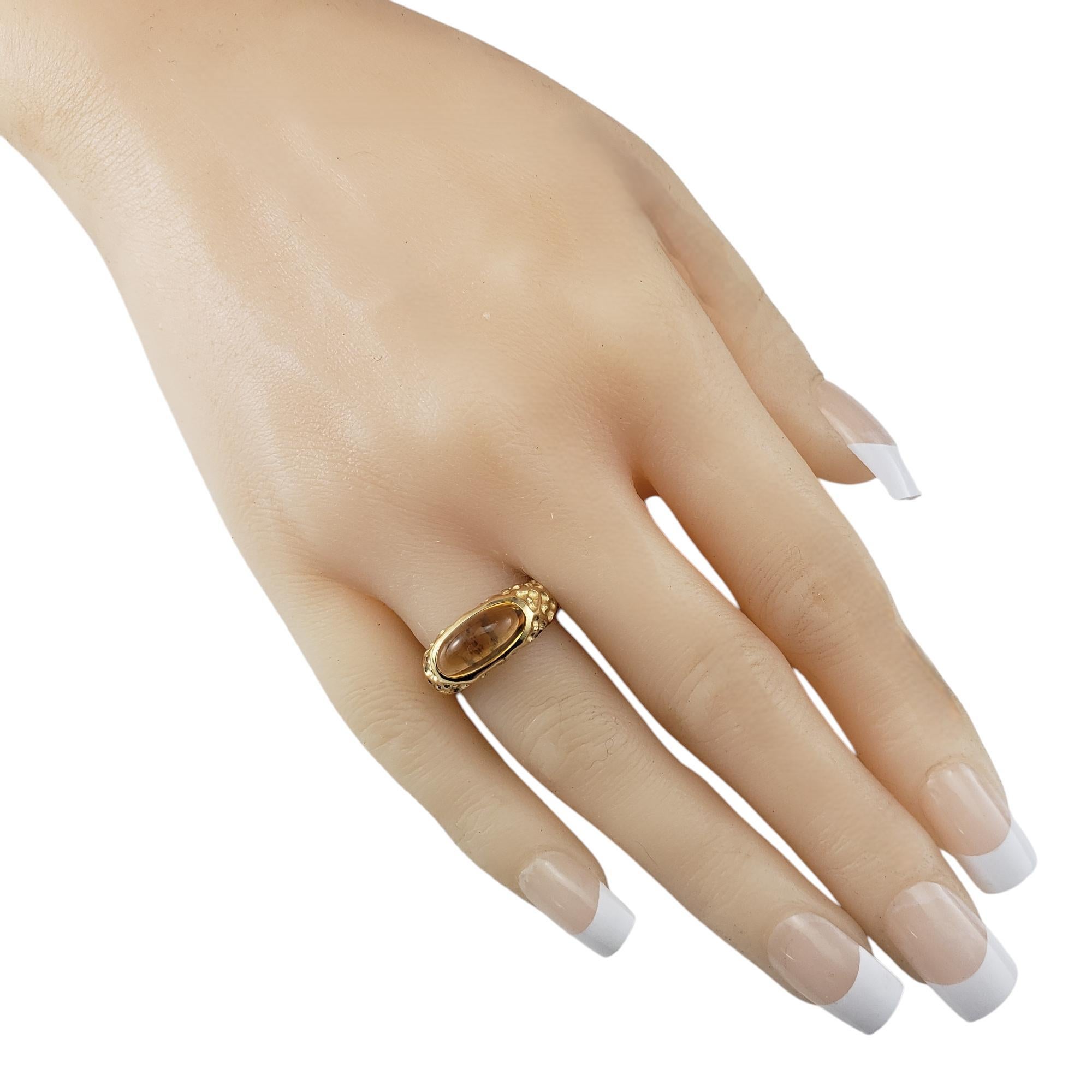 Manhattan 18 Karat Yellow Gold and Cabochon Citrine Ring Size 6.5

This 18K yellow gold ring is a bold yet elegant statement piece, featuring a richly hued cabochon citrine set in a beautifully textured gold band. Width: 8 mm.
Shank: 3 mm.

Ring