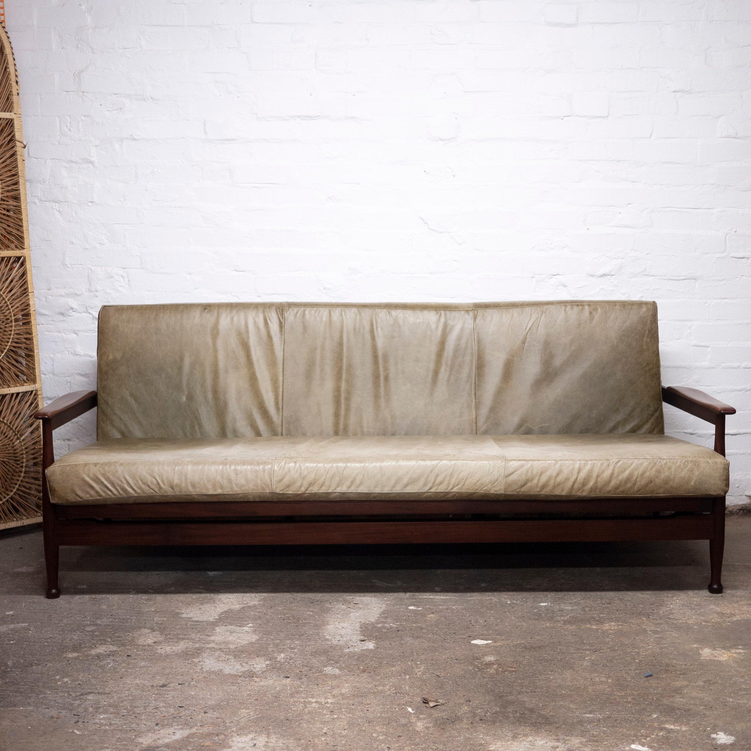 A sofa bed by Guy Rogers with an afromosia frame in green leather fabric.

Manufacturer - Guy Rogers

Designer - Eric Pamphilon and George Fejer

Design Period - 1960 to 1969

Style - Vintage, Mid-Century

Detailed Condition - Good

Restoration and