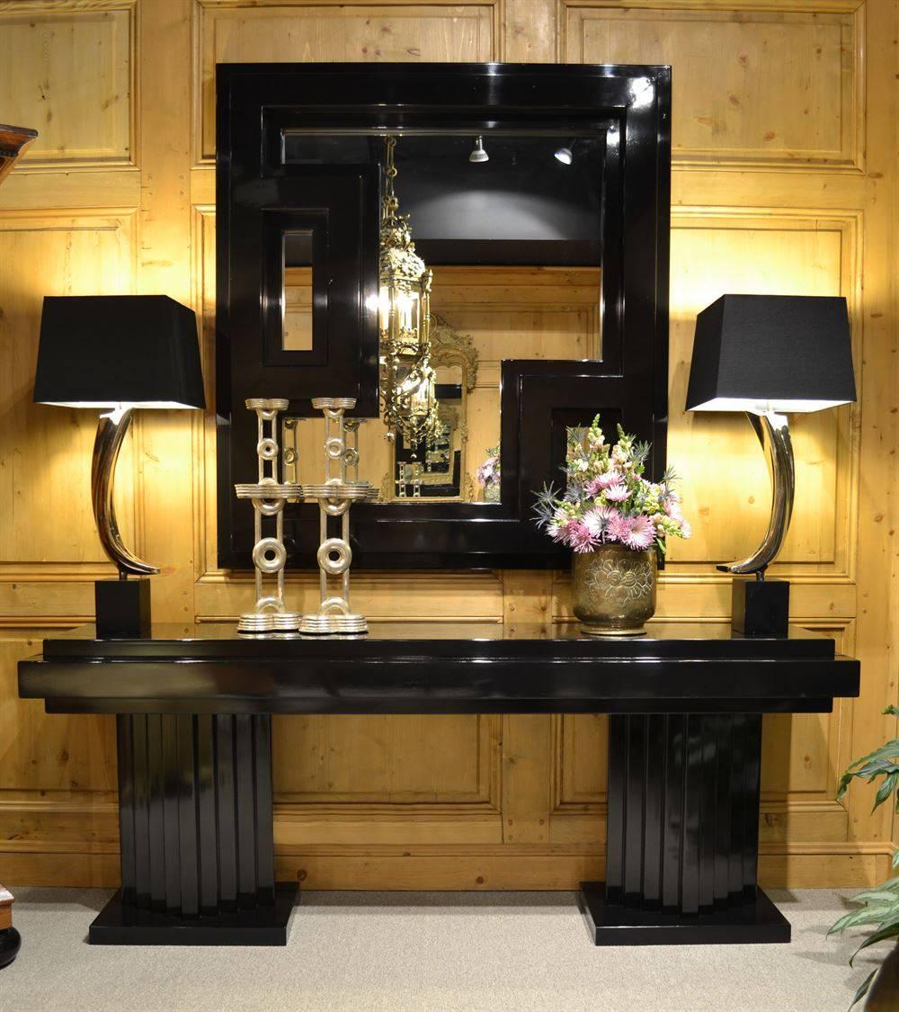 The Manhattan console and mirror are an original design created by Joann Westwater. These streamlined pieces are made of solid, MDF and ply materials and are designed for a painted finish. They're shown slightly distressed, in a soft gloss black