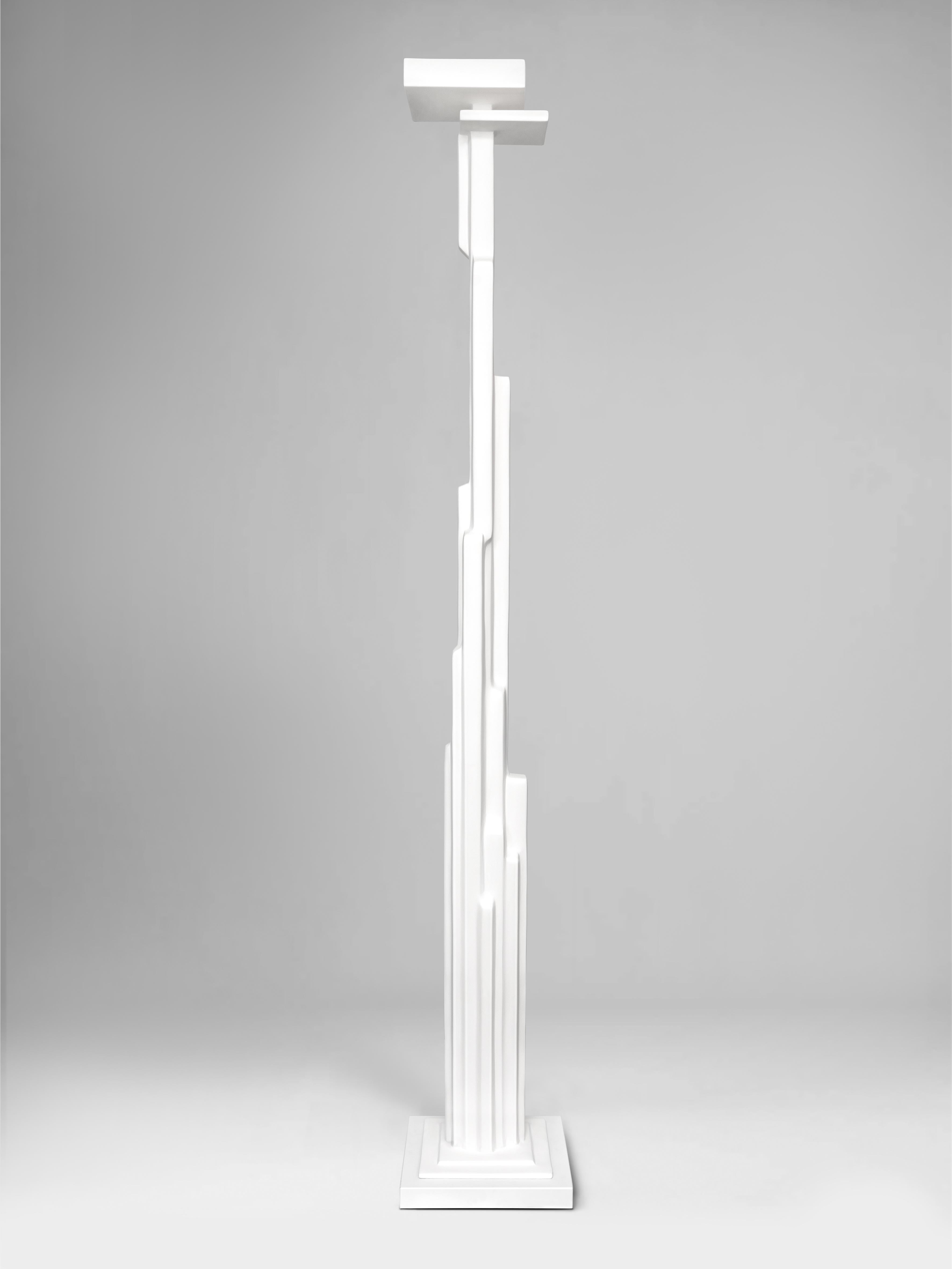 Assembled with various lengths of cut and joined steel bar on a White Quarzstone base, the Manhattan Floor Lamp resembles visual verticality of New York’s buildings. Hand sculpted and unique.  Uplighter with one bulb. In stock. Please, allow 2 weeks