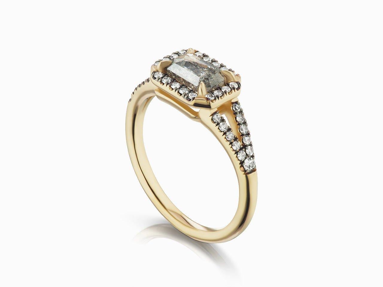MANIAMANIA Etherea Engagement ring in 14k yellow gold ring with a Grey rustic Emerald cut diamond (set inverted, 7x5mm, in range of 1 ct), with pavé of white diamond halo and along the split shank (0.23 ctw) This ring is a Size 6.25.  

*This ring