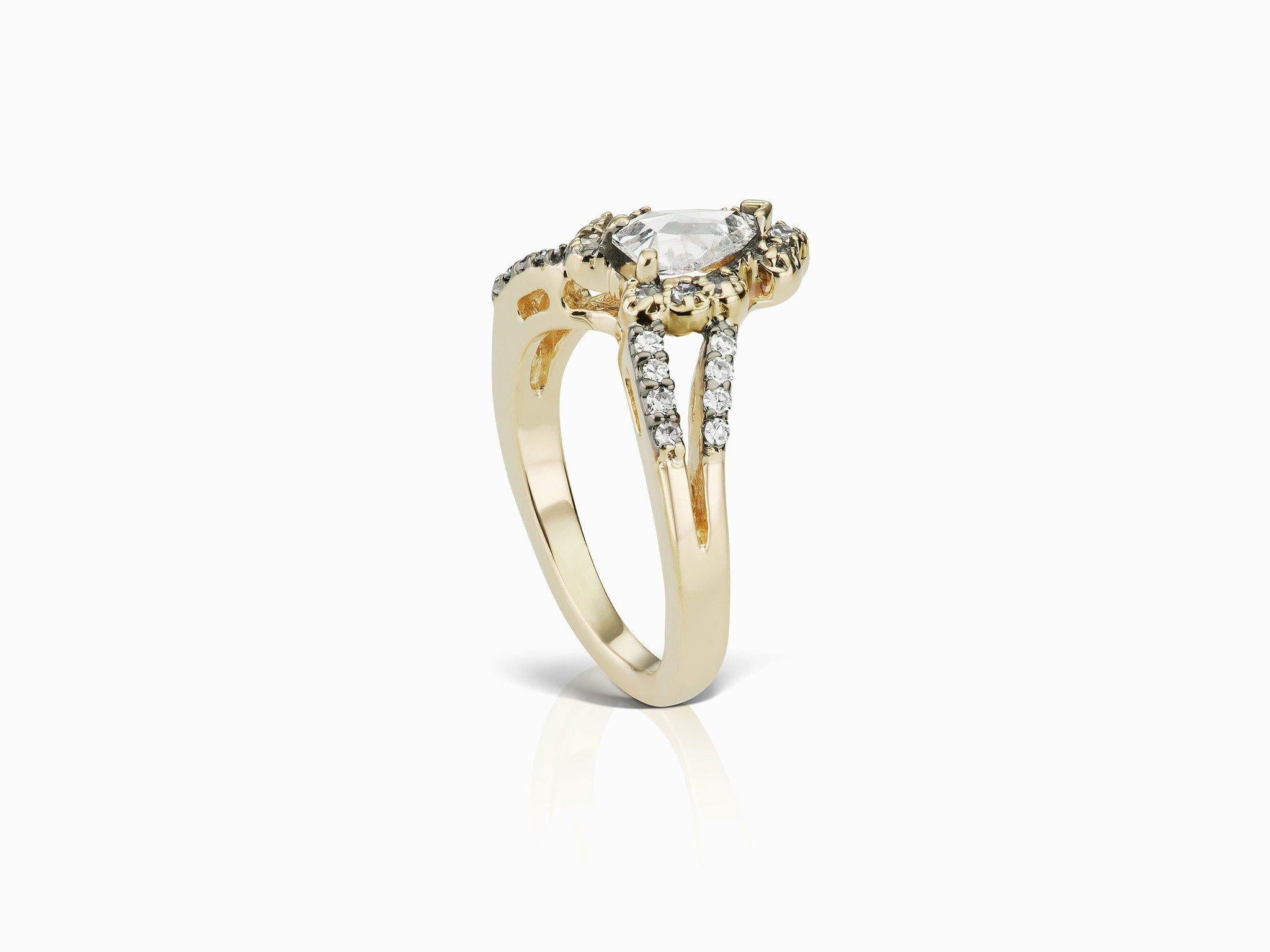 MANIAMANIA Ritual Ring in 14k Yellow Gold with 7x5mm pear-shaped rose cut White Diamond (0.55-0.65ct), with halo and pavé accents of White Diamonds (0.45ctw). *This item is made to order, the lead time will be 4-6 weeks. We will send the full