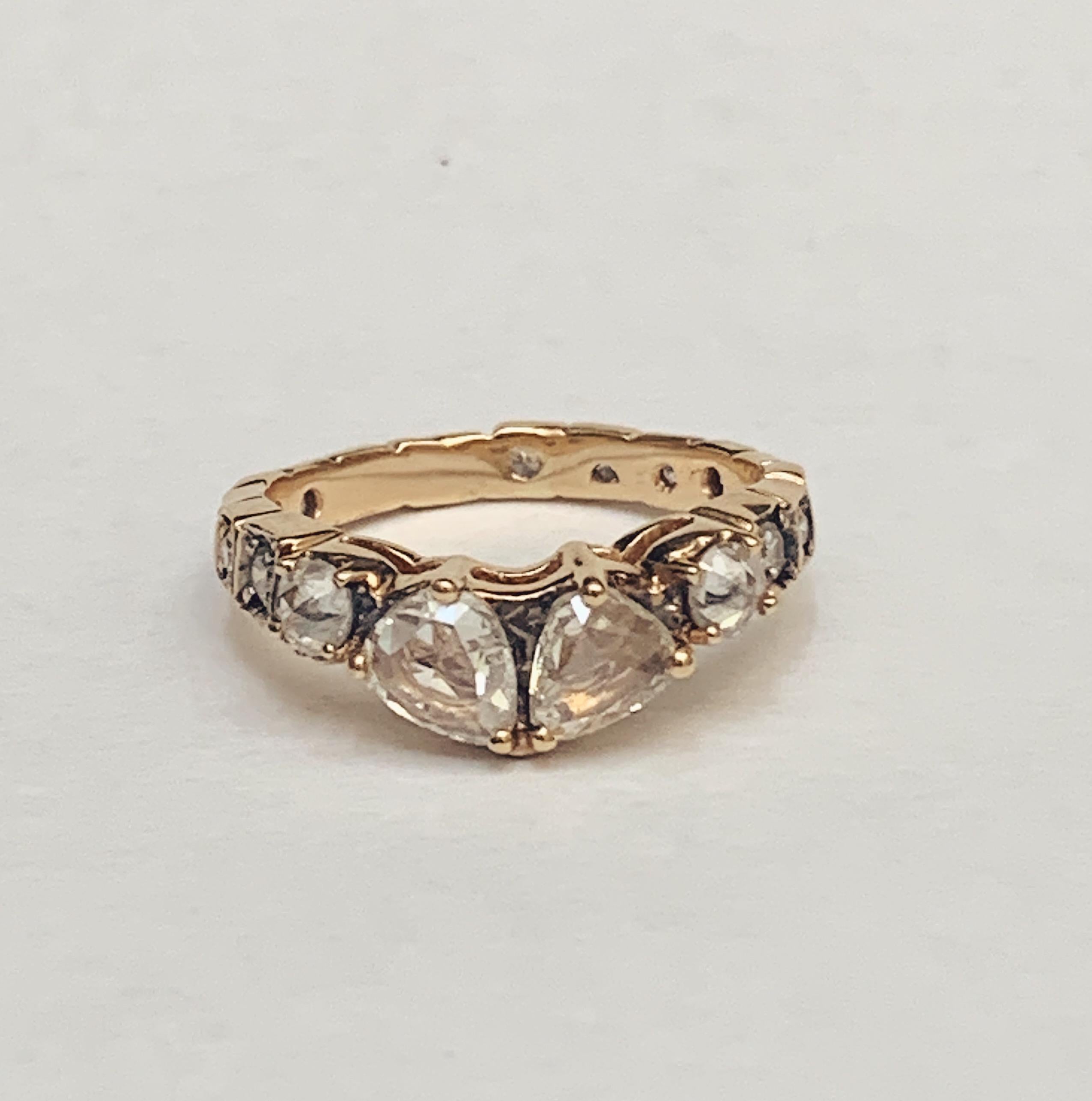 MANIAMANIA Sacred band in 14k yellow gold with White Diamonds. Featuring two 5x4mm rose cut pear-shaped White Diamonds (0.4-0.5ctw), two 3mm round rose cut Rustic Diamond shoulders (0.24ct), and eternity band of diamond accents (0.4ctw). Size
