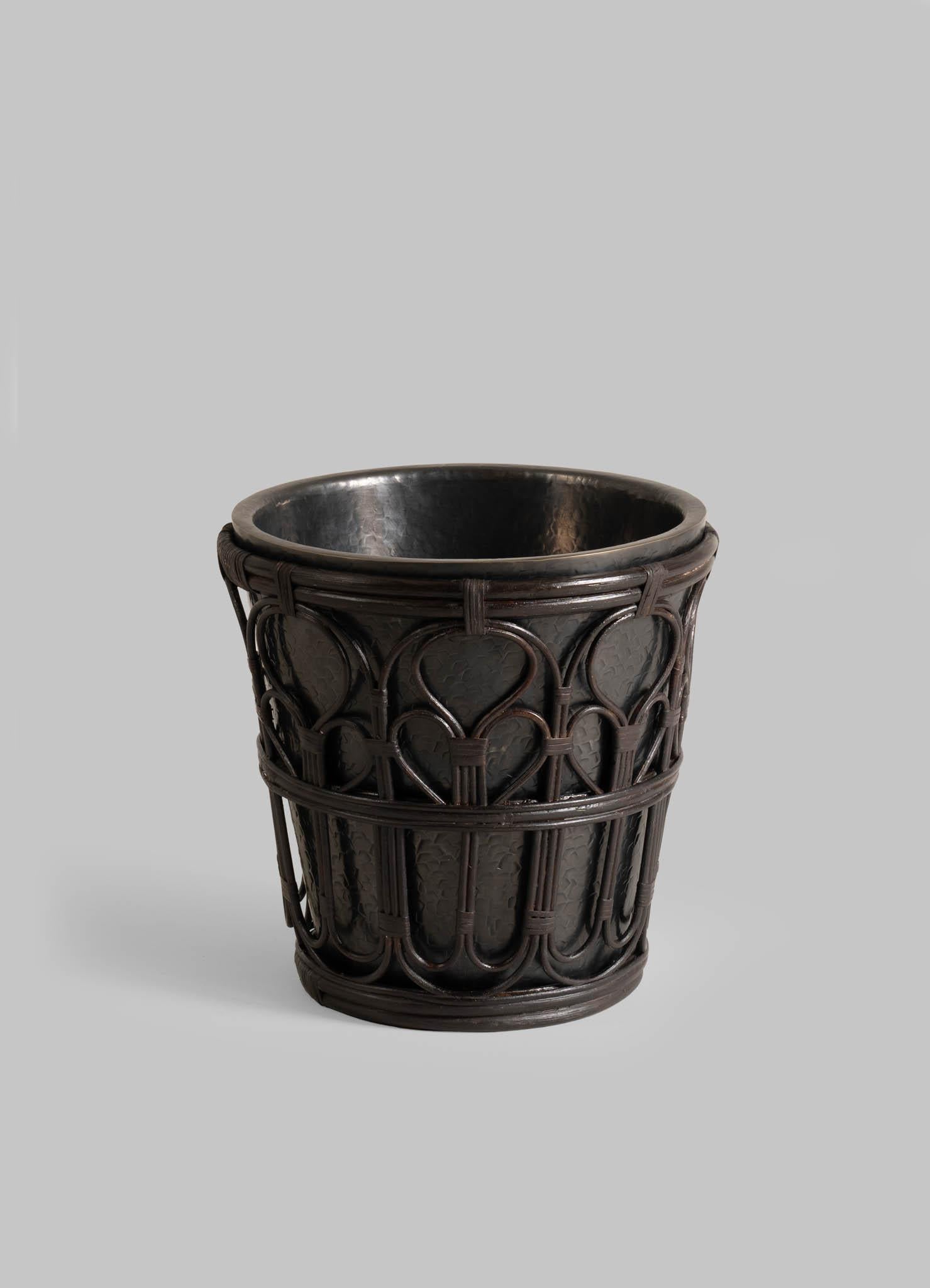 Manipur Champagne Bucket in Brass and Cane, Viya By Vikram Goyal

A classic pairing, reimagined. Robust cane becomes latticed second skin to the hand-beaten brass objects in an effortless collaboration. These barware accessories are crafted as
