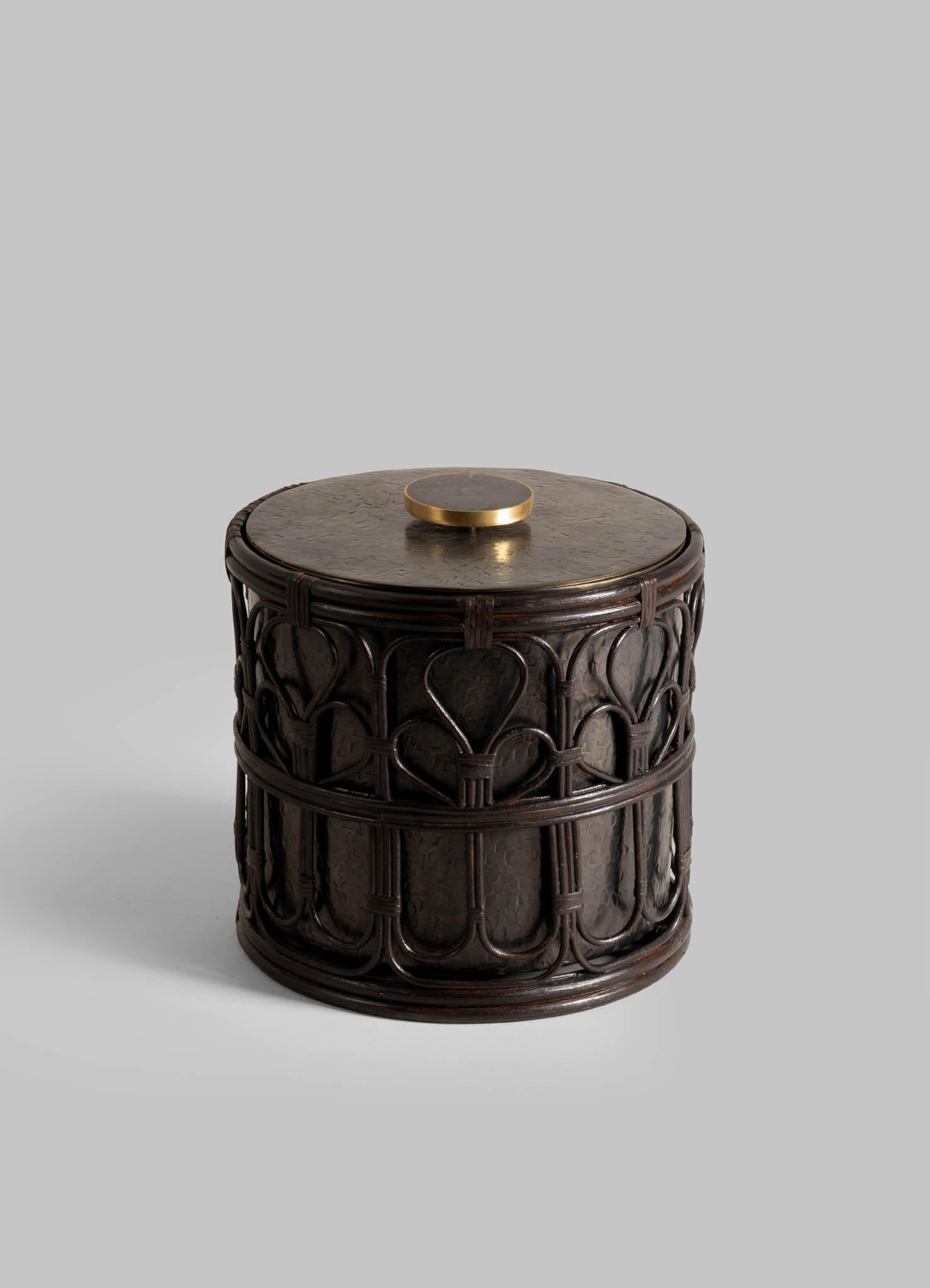 Manipur Ice Bucket Large in Brass & Cane, Viya By Vikram Goyal

A classic pairing, reimagined. Robust cane becomes latticed second skin to the hand-beaten brass objects in an effortless collaboration. These barware accessories are crafted as perfect
