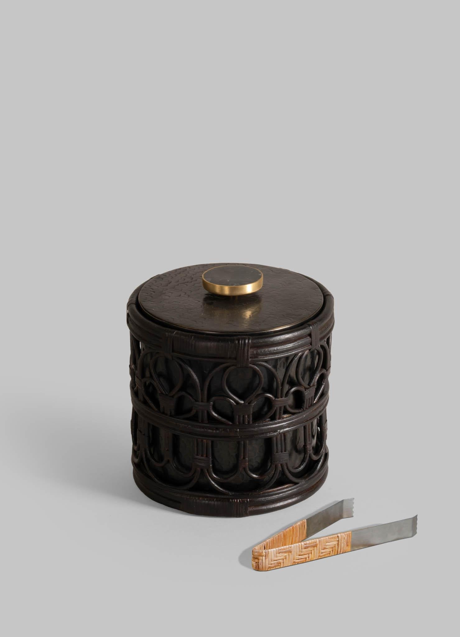 Manipur Ice Bucket Small in Brass & Cane, Viya By Vikram Goyal

A classic pairing, reimagined. Robust cane becomes latticed second skin to the hand-beaten brass objects in an effortless collaboration. These barware accessories are crafted as perfect