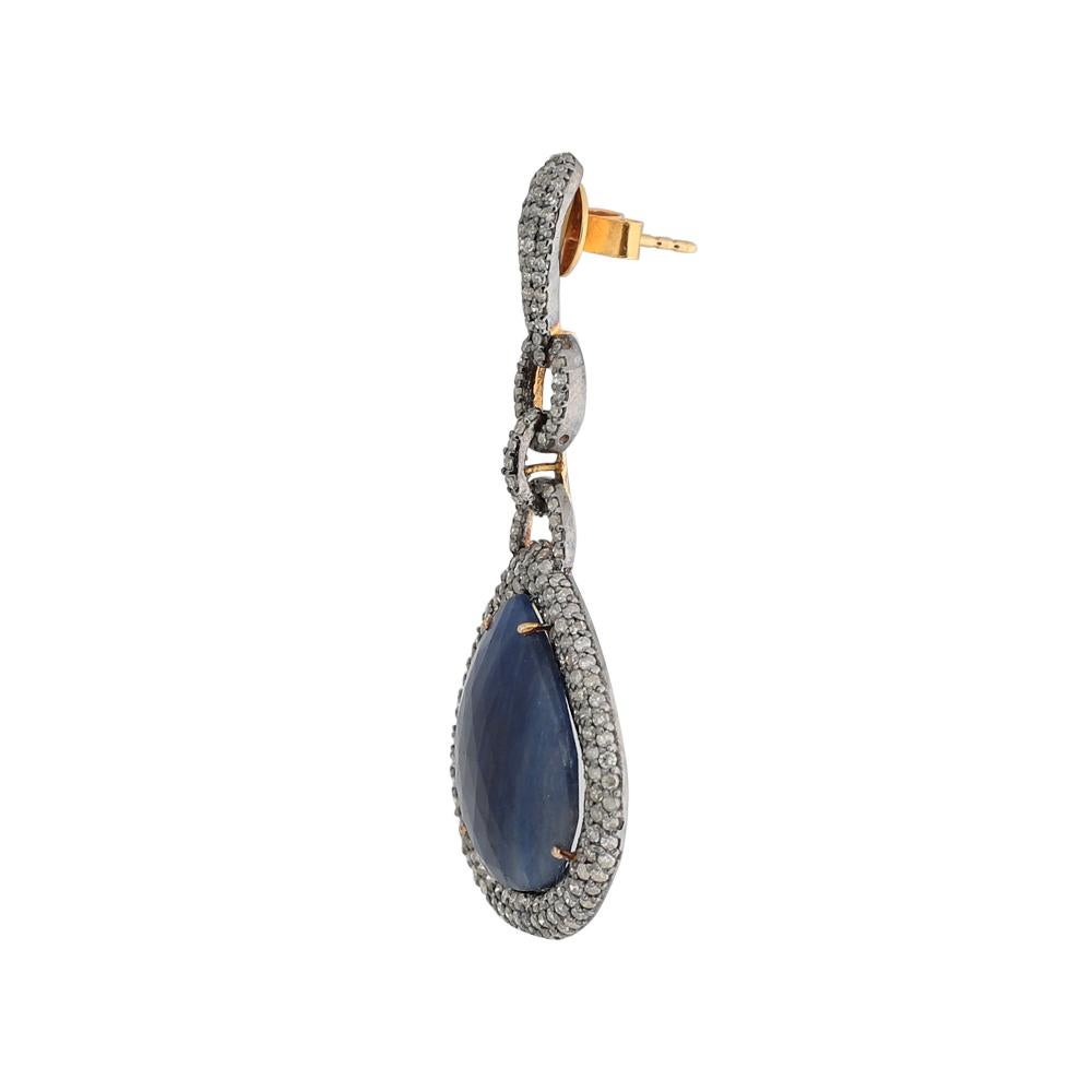 These masterfully crafted earrings comprising single-cut diamonds and natural sapphires are fashioned in Victorian setting with 18k gold back post and push.
Total weight 15.95gm. Diamond 3.90ct. Color Stones 29.84ct.
Back Closure: Stud with