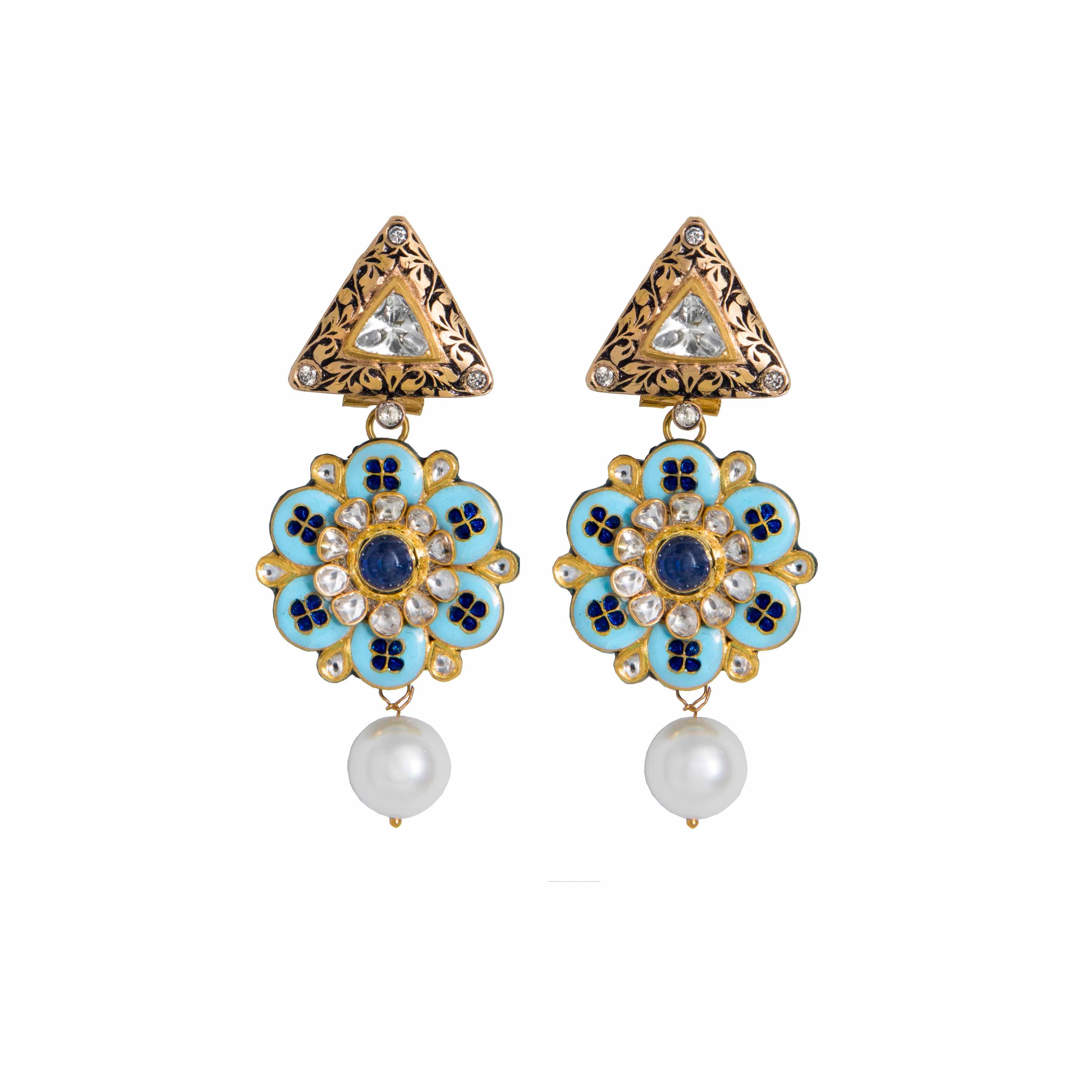 Earring bottoms comprise blue Tanzanite with syndicate polkis (uncut diamonds) inside and around the flower, with turquoise, blue and gold enamel. The tops feature Zimbabwean polkis (uncut diamonds) in the centre, double cut diamonds at the sides,