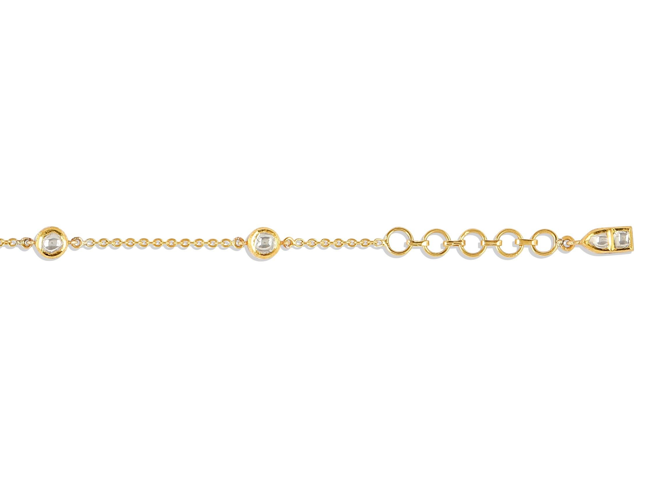 This striking bracelet is styled with Polki Diamonds (Uncut Diamonds) and is set in 18 Karat Yellow Gold. Designed to magnify your sparkle, this artistically and intricately crafted double-sided bracelet is reversible so the Polki Diamonds can shine