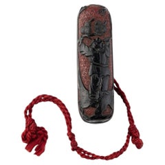 Manju Nestuke in black and lacquer decorated of a scene of child under a pine