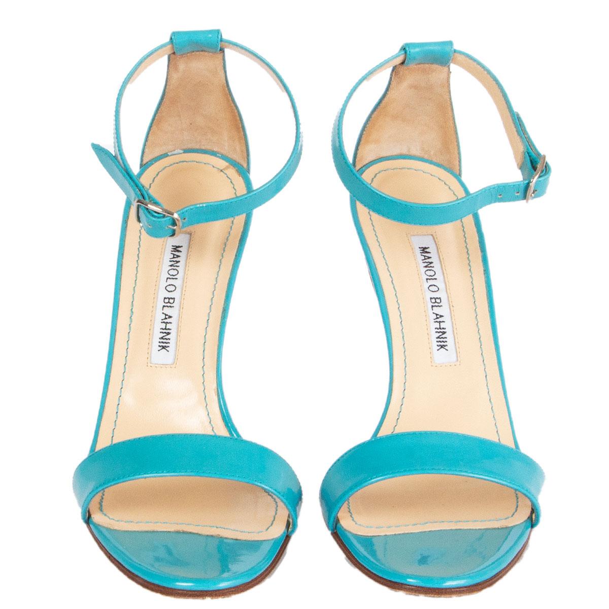 100% authentic Manolo Blahnik Chaos ankle-strap sandals in blue patent leather. Have been worn and are in excellent condition. Come with dust bag. 

Imprinted Size	38
Shoe Size	38
Inside Sole	24.5cm (9.6in)
Width	7.5cm (2.9in)
Heel	10cm