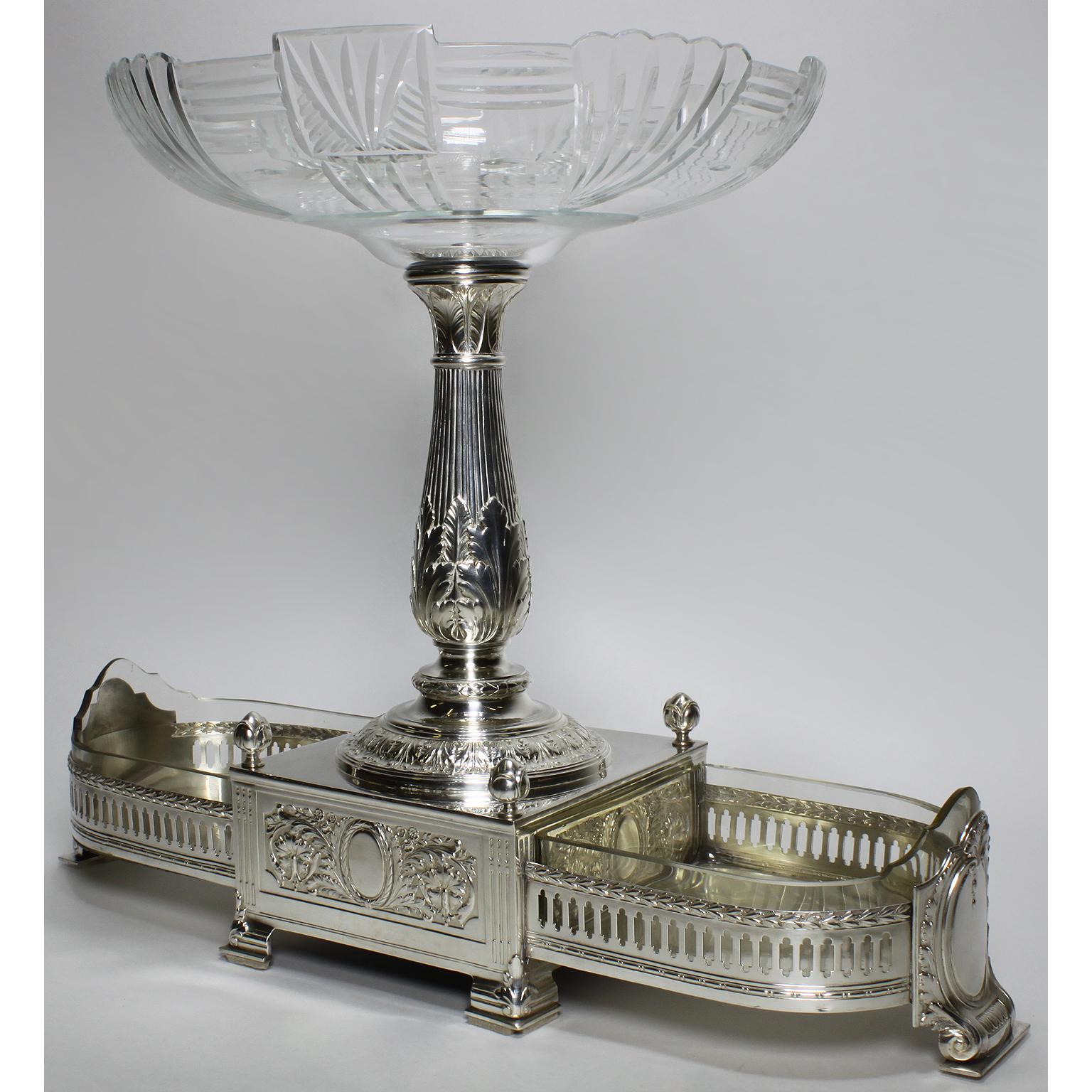 A fine and rare 19th-20th century neoclassical Revival style silver plated metal and cut-glass centerpiece in the manner of Christofle. The boat-shaped ornately body with finely chased detailed laurels and wreaths centered a candelabra-shaped stem