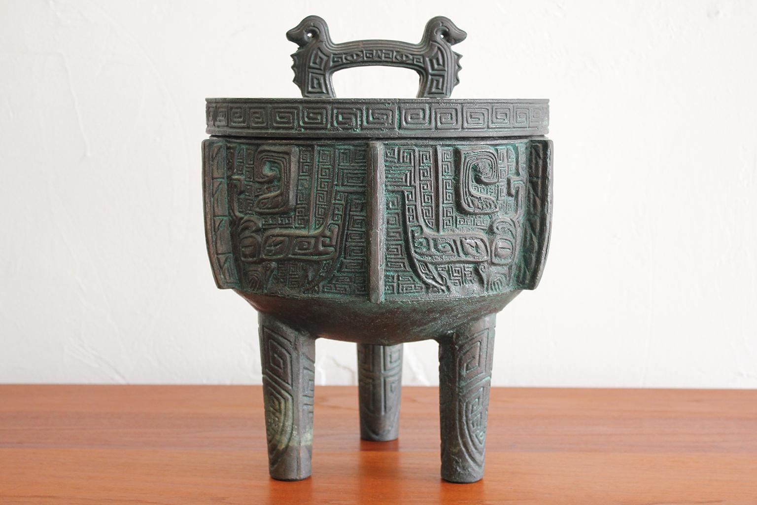 Great ice bucket in the manner of James Mont, circa 1960s. Has a Chinese/Asian design with a verdigris finish. Ice bucket is in excellent shape with very light use over the years. Measures: 13.5