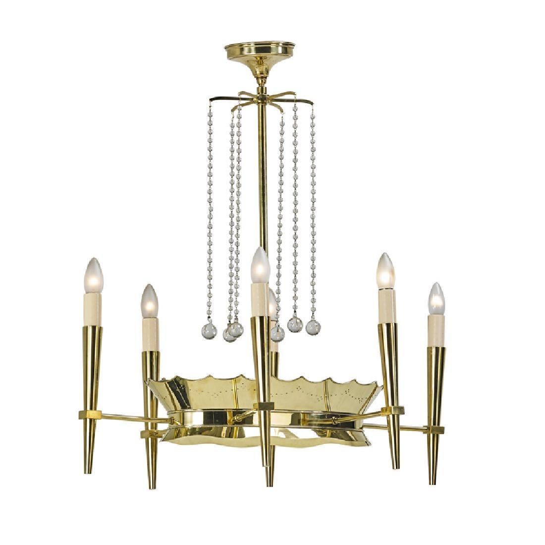 A six arm chandelier in the manner of Tommi Parzinger. Unique oval crown shaped central design holds a frosted glass diffuser. Center canopy contains six cascading crystal drops with prisms. Possibly a custom piece or prototype. The brass has been