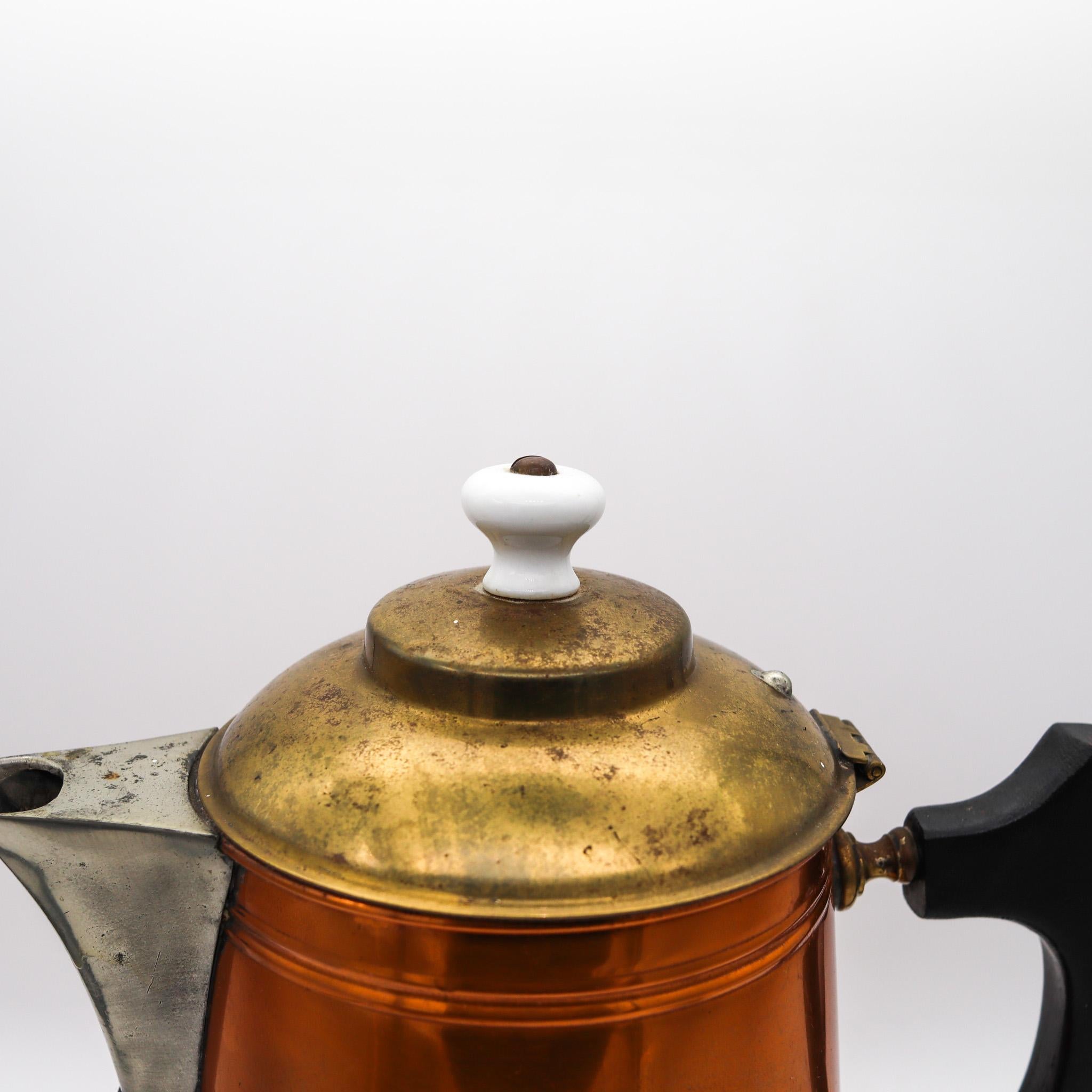 An industrial age pitcher designed by Manning Bowman Co.

A industrial age pitcher-coffee/tea pot, created in Connecticut North America by the Manning Bowman Company, back in the late 1899. Crafted with streamlines patterns in copper, brass and