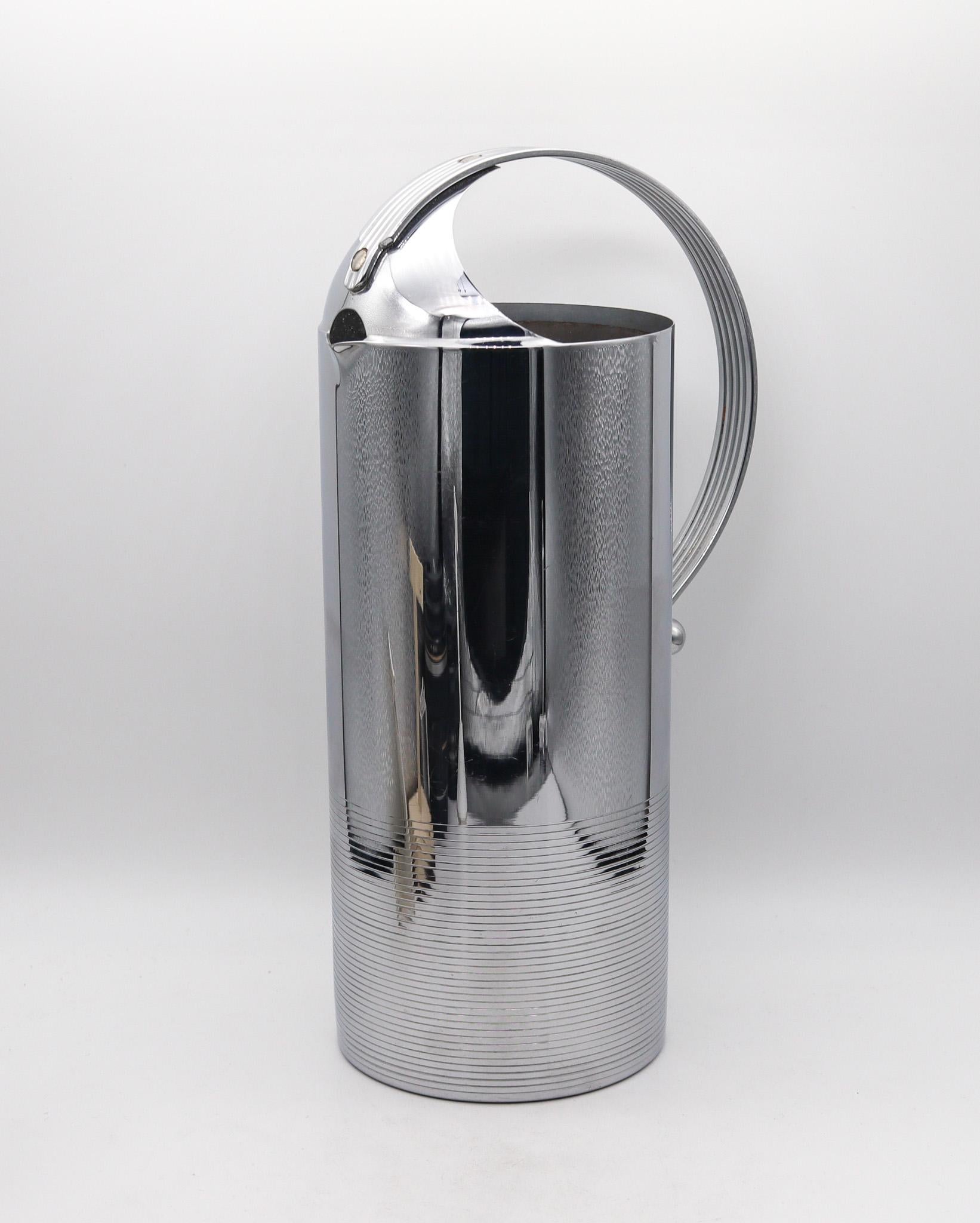An art deco pitcher designed by Norman Bel Geddes for Manning Bowman.

A fabulous art deco machine-age pitcher, created in America by the Manning Bowman Company, back in the late 1930. This design of this original and avant garde piece was conceived