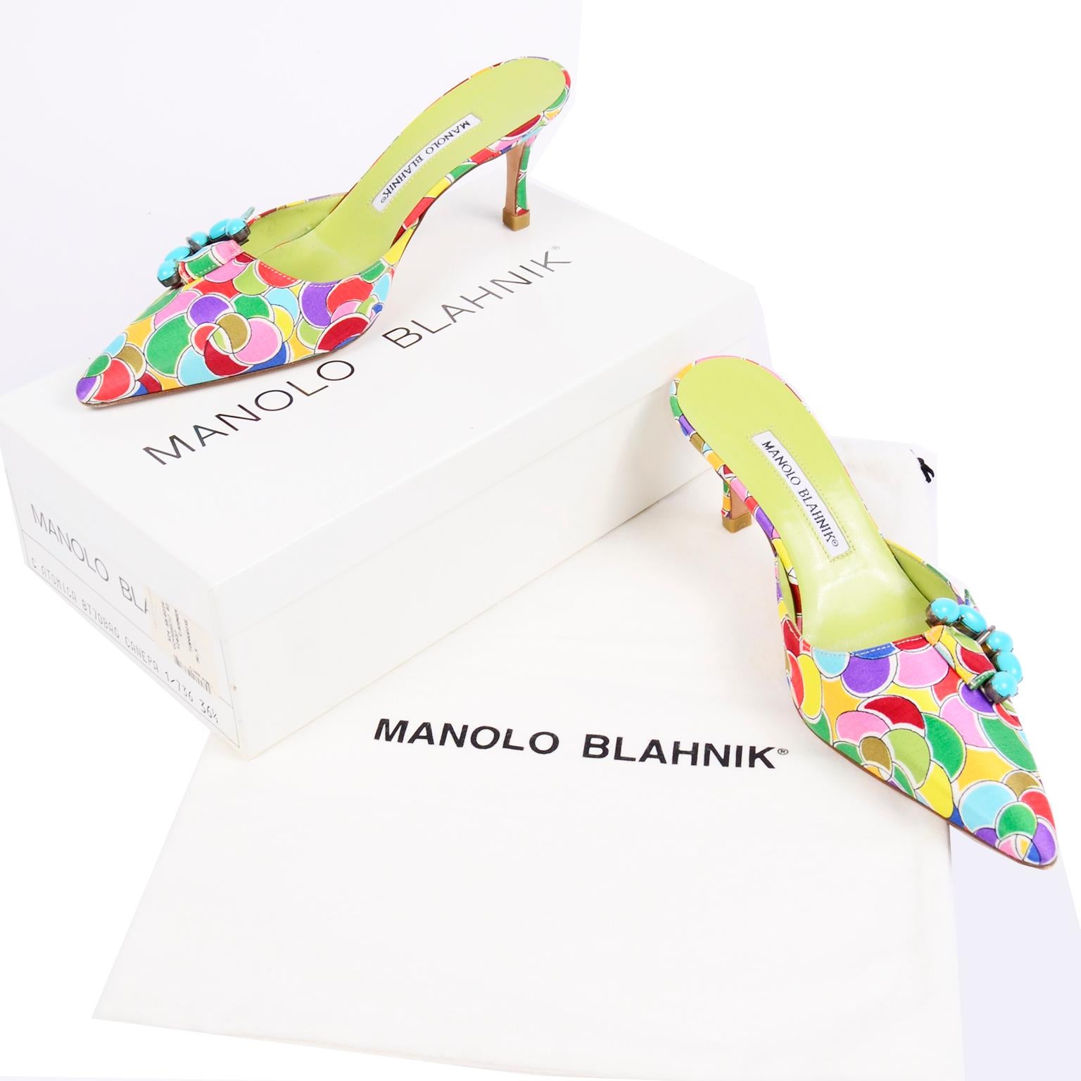 These are such fun, brightly colored Manolo Blahnik heeled mules with turquoise and rhinestone buckles. These fabulou shoes have a colorful printed pattern in shades of blue, red, light blue, purple, tangerine, yellow, green, olive, and white. The