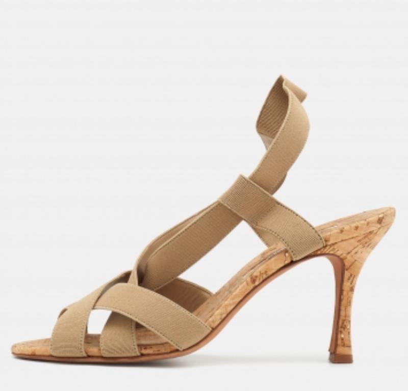 Manolo Blahnik is well-known for his graceful designs, and his label is synonymous with opulence, femininity, and elegance. These slingback sandals are crafted from Grosgrain in a beige shade into an open-toe silhouette augmented by multiple straps.