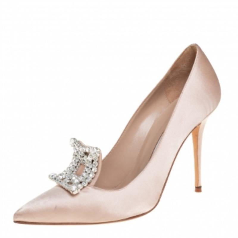 Walk with grace and confidence in these Borlak pumps by Manolo Blahnik. Styled as a pointed toe, with gorgeous crystal embellishment on the vamps, leather lining, and 11 cm high stiletto heels, this beige satin pair will never fail to lift your